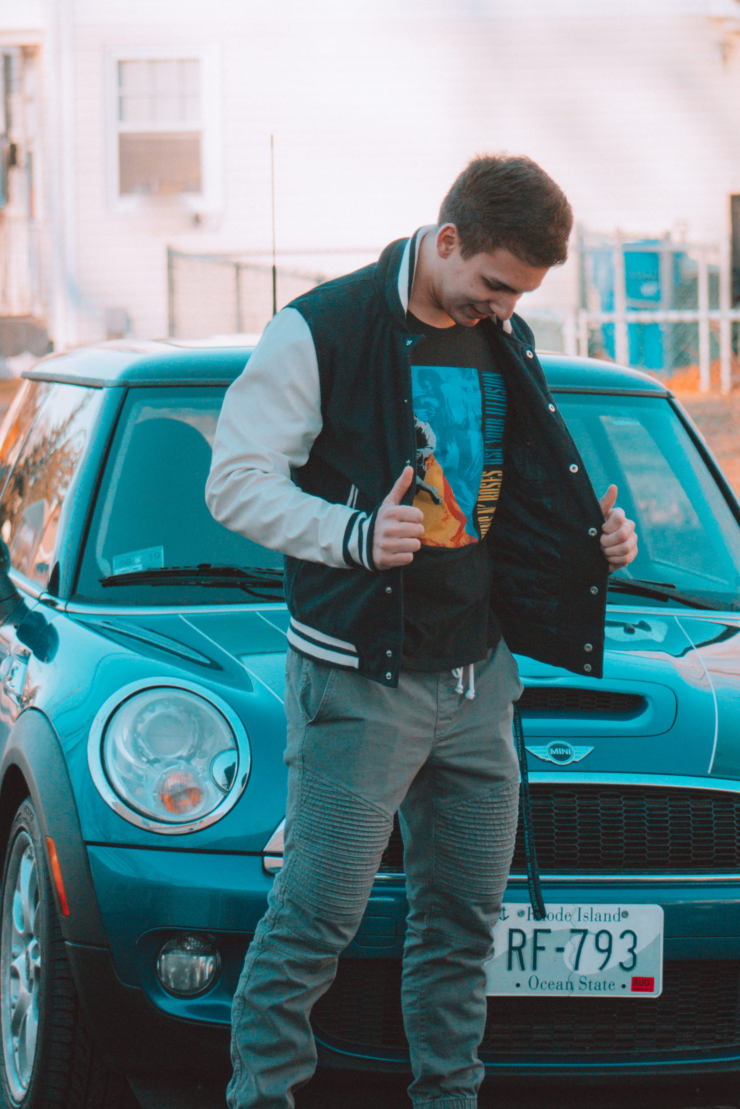 graphics, orange, adult, car, t shirt, sports, eyes, poster, three quarter length, front view, holding, looking, one person, land vehicle, fitness, city, Phone HD Wallpaper