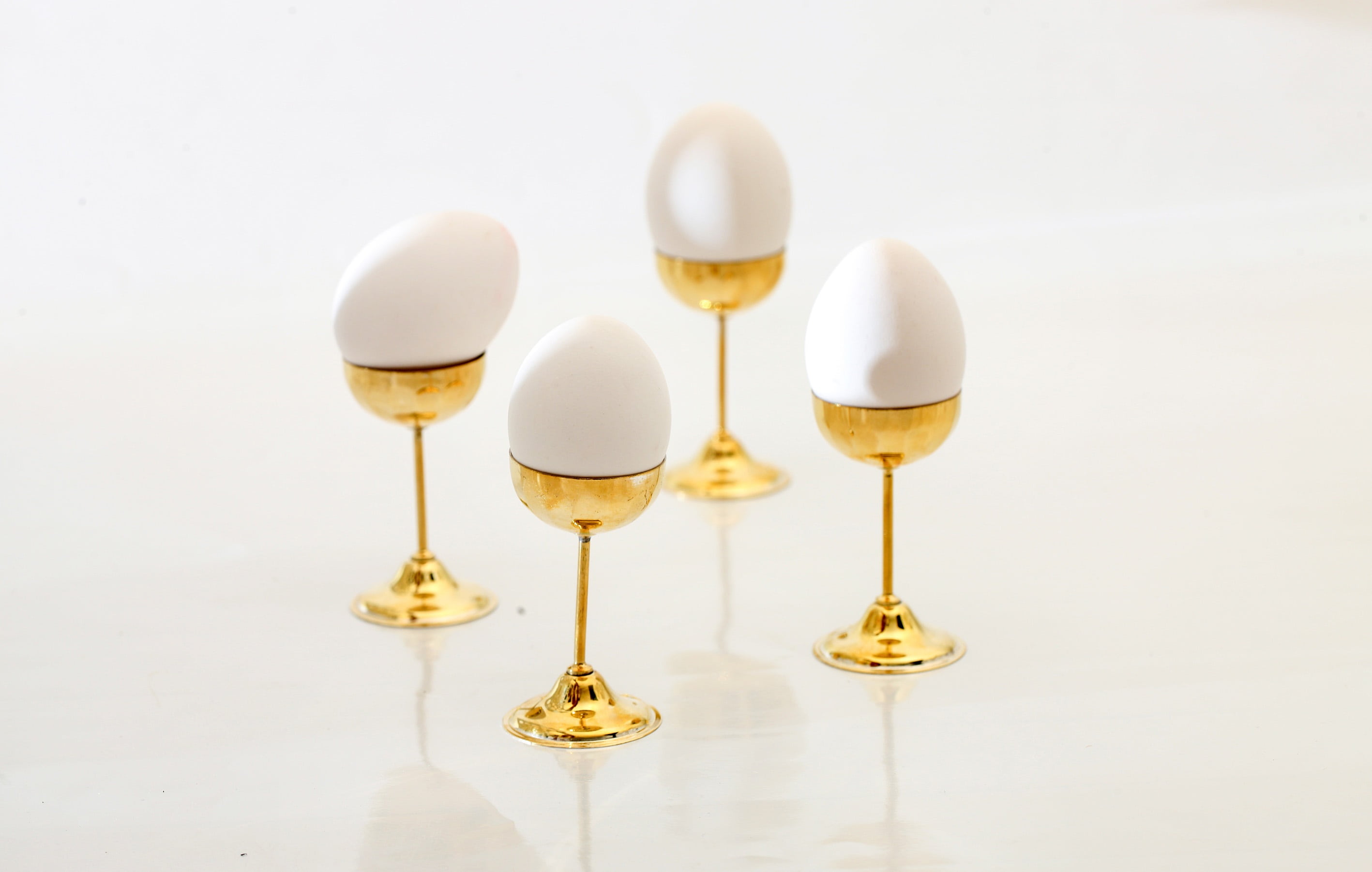 gold colored, no people, glass, reflection, vintage, white color, gilt, in a row, golden, glass - material, white background, day, pedestal, indoors, group of objects, HD Wallpaper