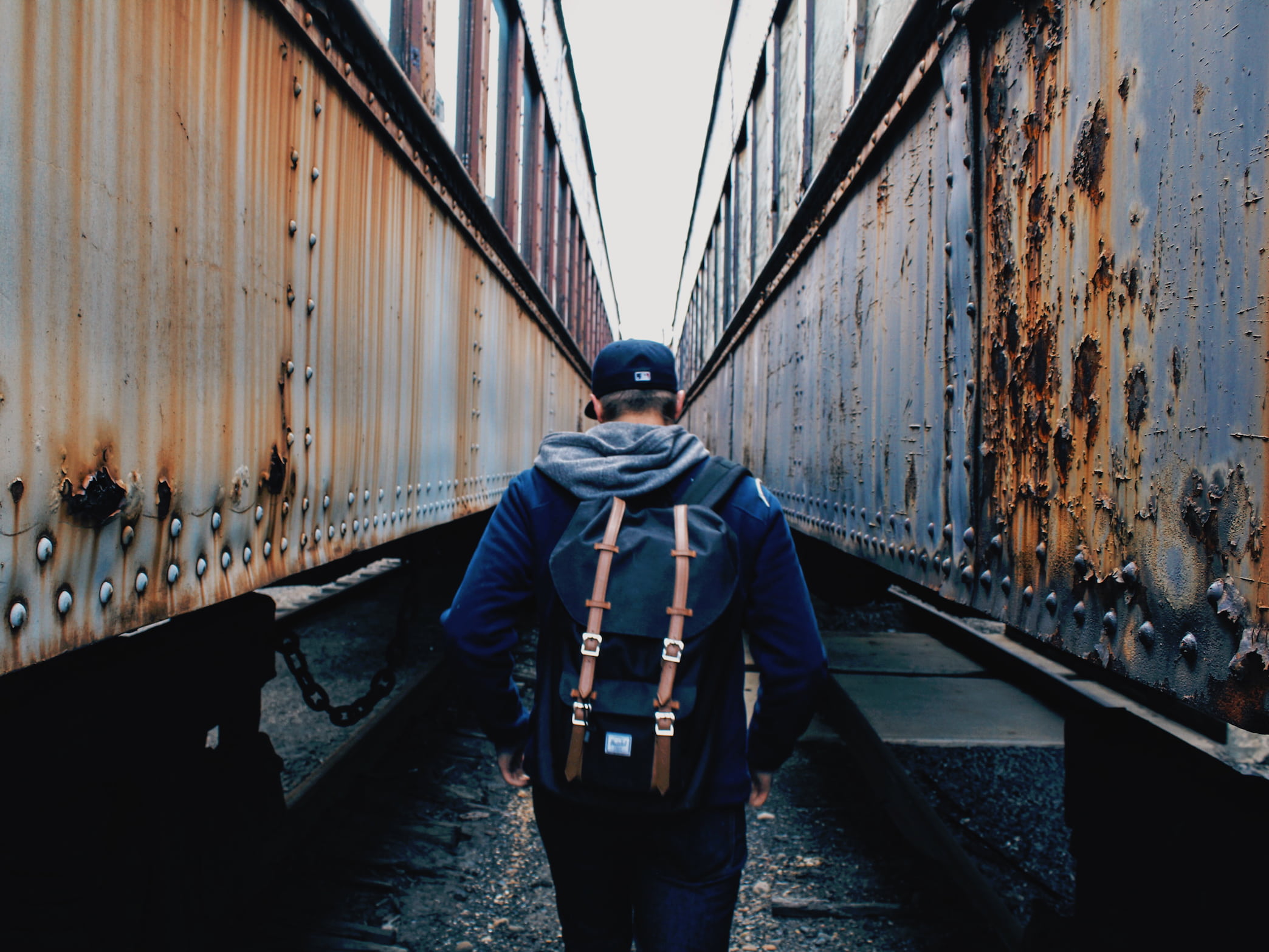 herschel, building exterior, rust, real people, rear view, three quarter length, clothing, men, snapback, people, direction, trucks, trains, man, bridge, HD Wallpaper