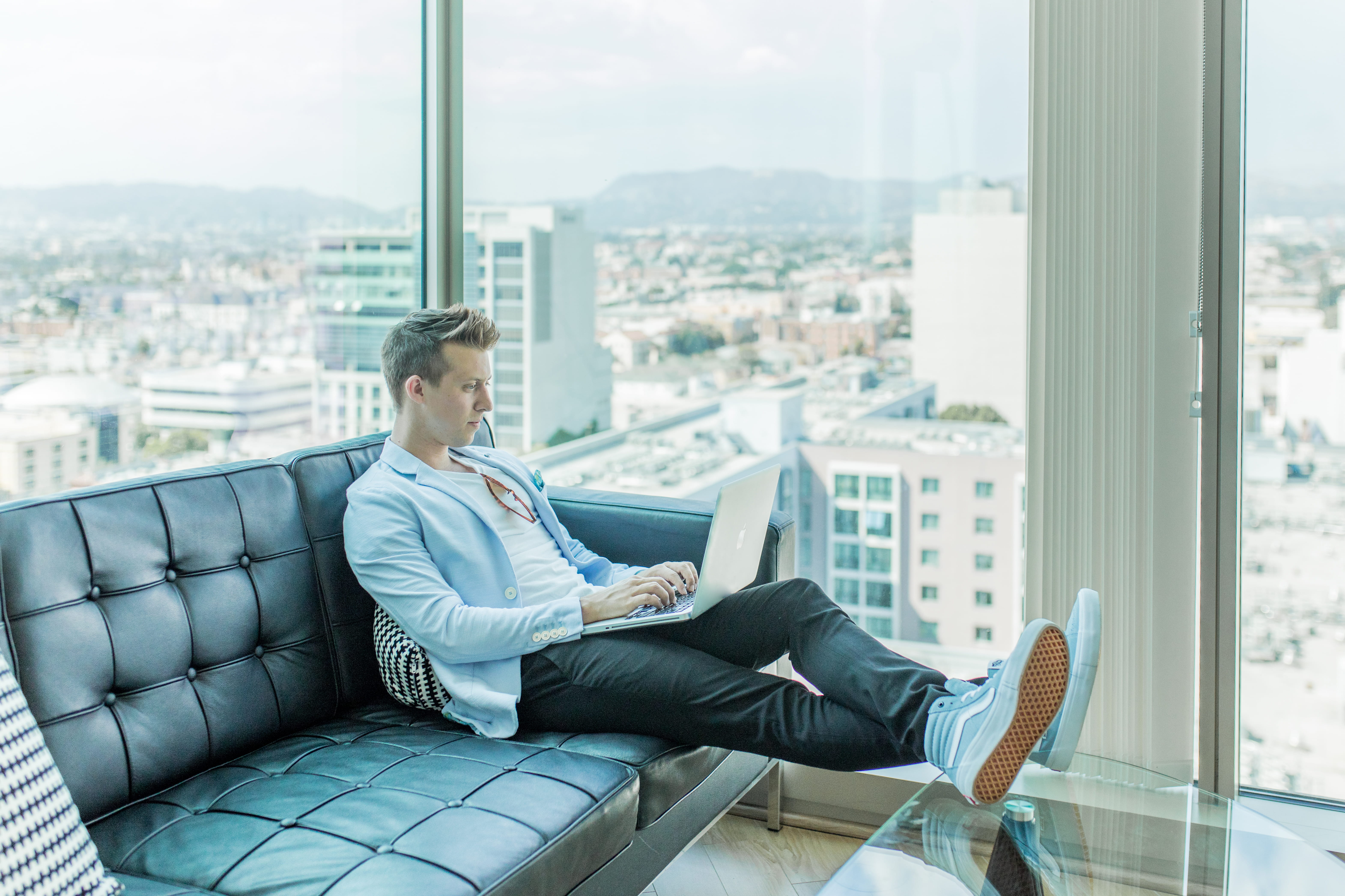 glass, connection, couch, computer, cityscape, foot, sofa, public figure, young adult, relaxation, wireless technology, speaker, casual clothing, author, HD Wallpaper