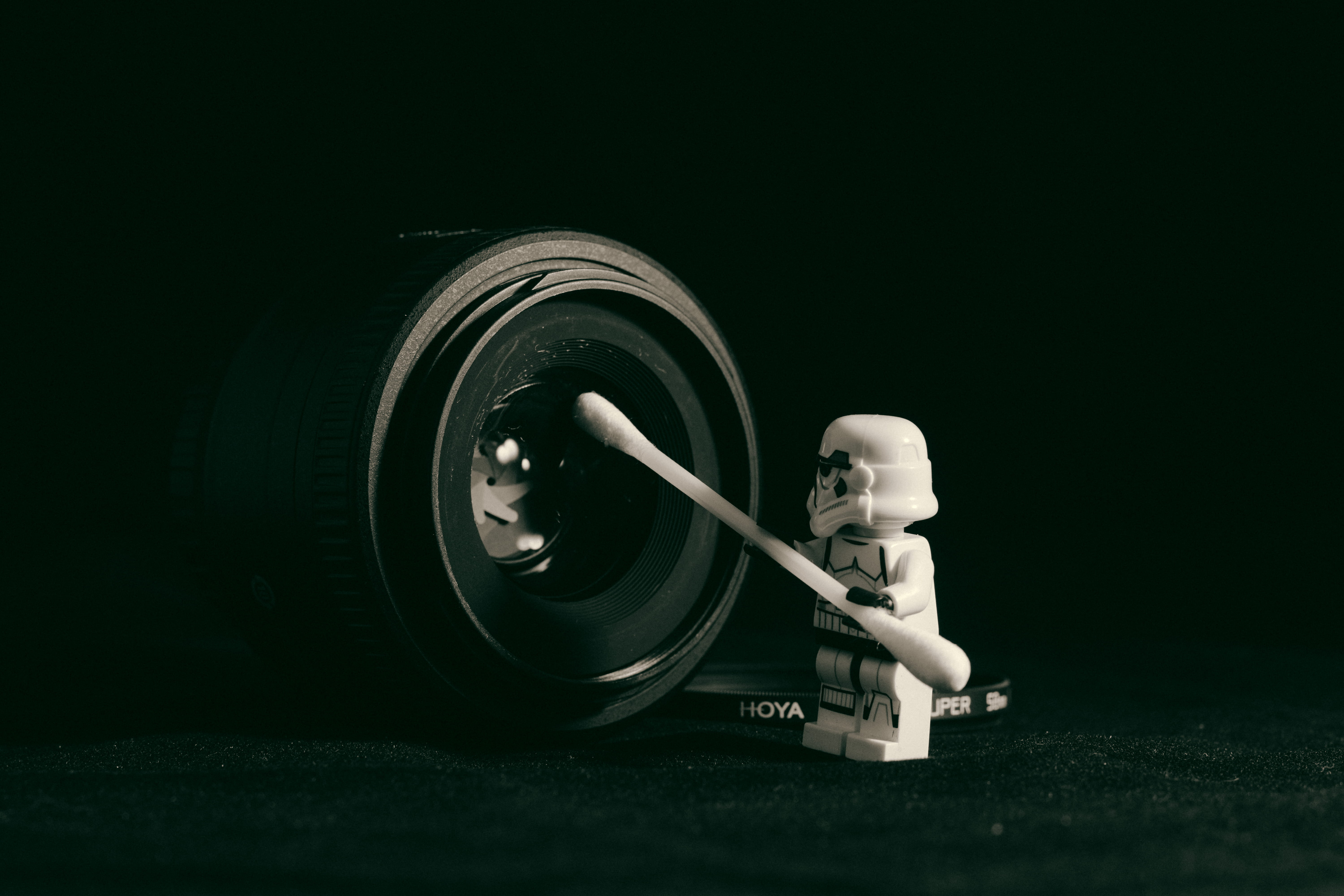 black background, camera, lego, holding, len, black color, star war, technology, indoors, q-tip, selective focus, photography themes, swab, pointed, studio shot, HD Wallpaper