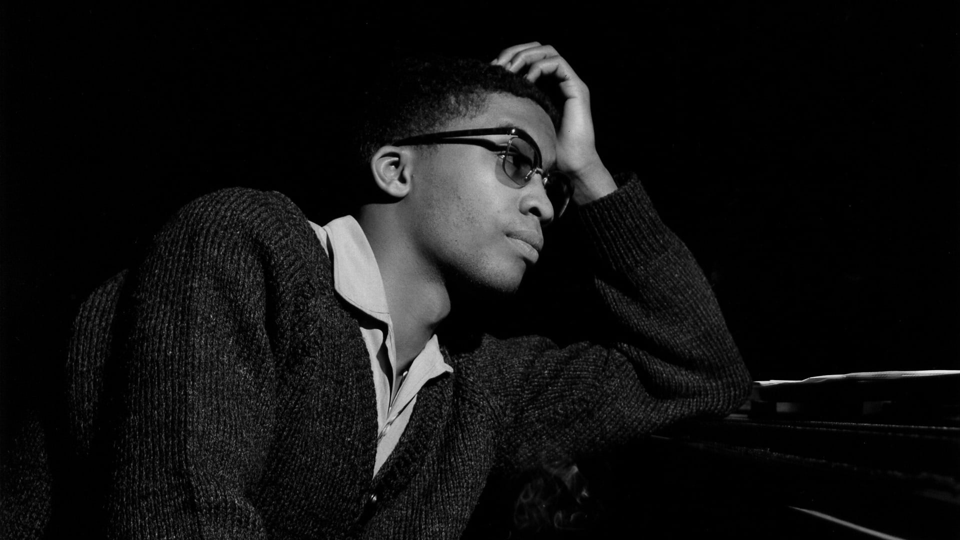 herbie hancock, contemplation, clothing, glasses, front view, indoors, dark, waist up, coat, 1080P, s, hand, formal, black background, look, young men, HD Wallpaper