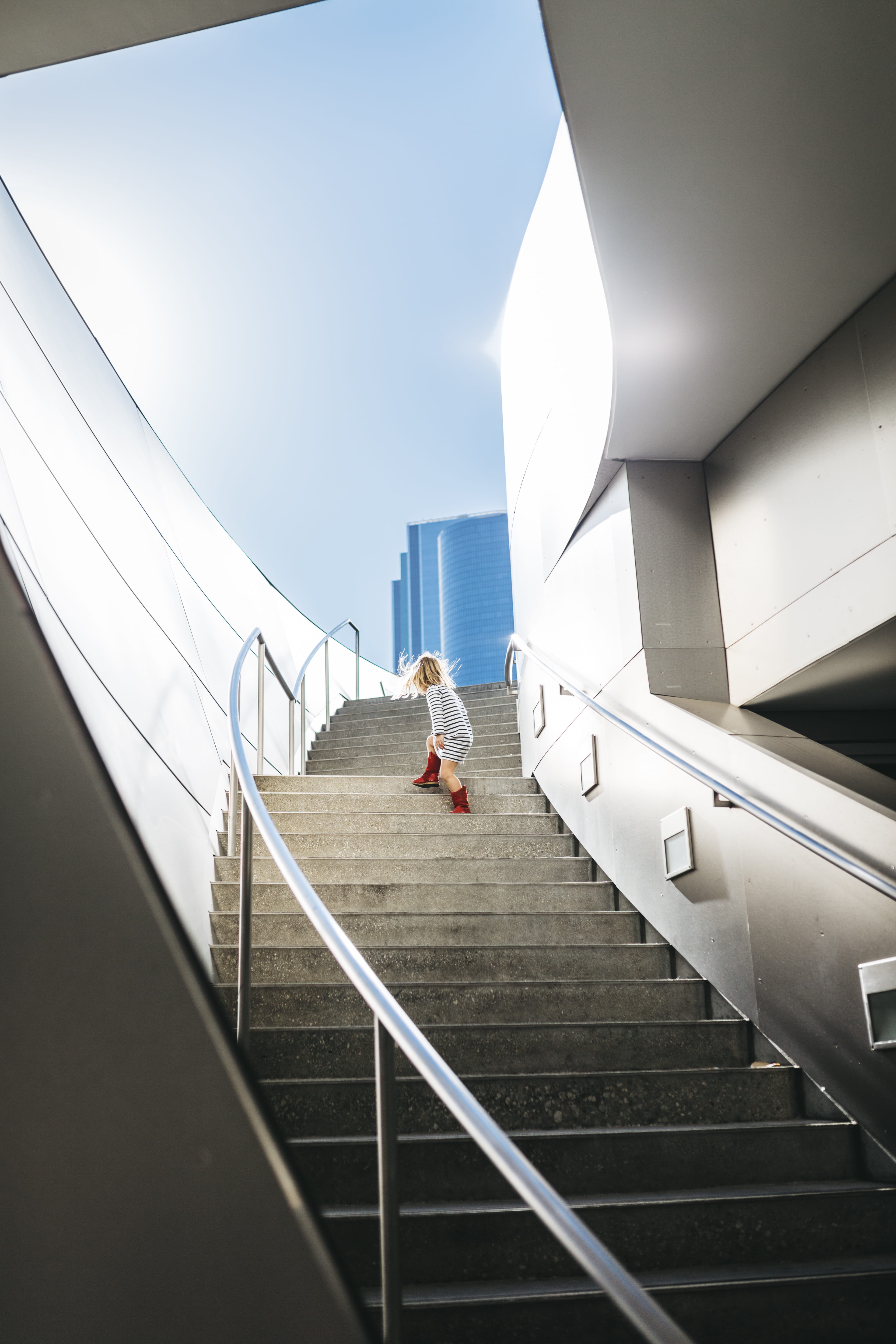 outdoors, climbing, low angle view, women, leisure activity, staircase, sky, sunlight, stairway, steps, one person, the way up, caucasian Ethnicity, child, Phone HD Wallpaper