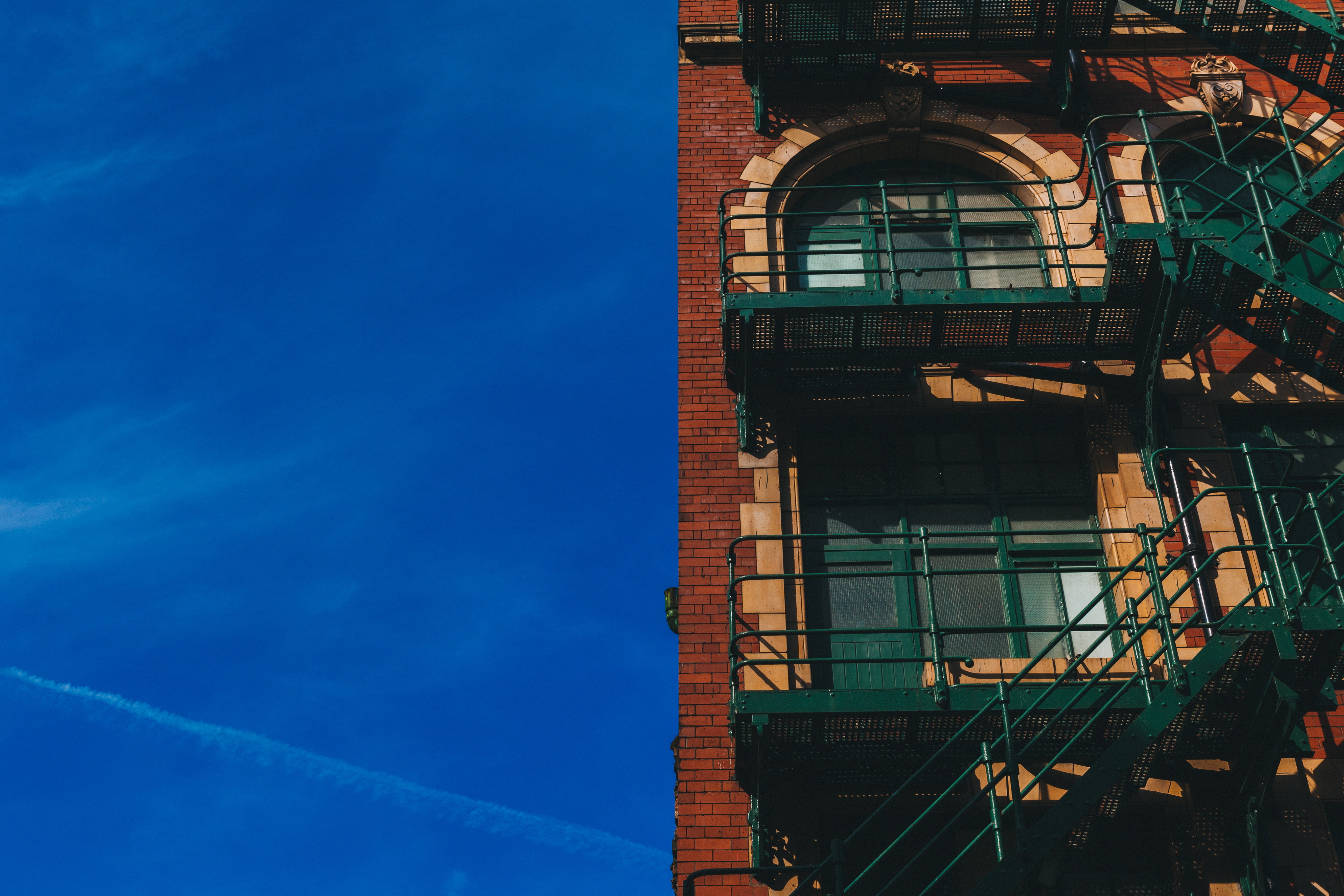 no people, stairs, windows, brick wall, stone, exit, building exterior, staircase, window, low, 5K, sky, architecture, fire exit, sunlight, angle, facade, HD Wallpaper