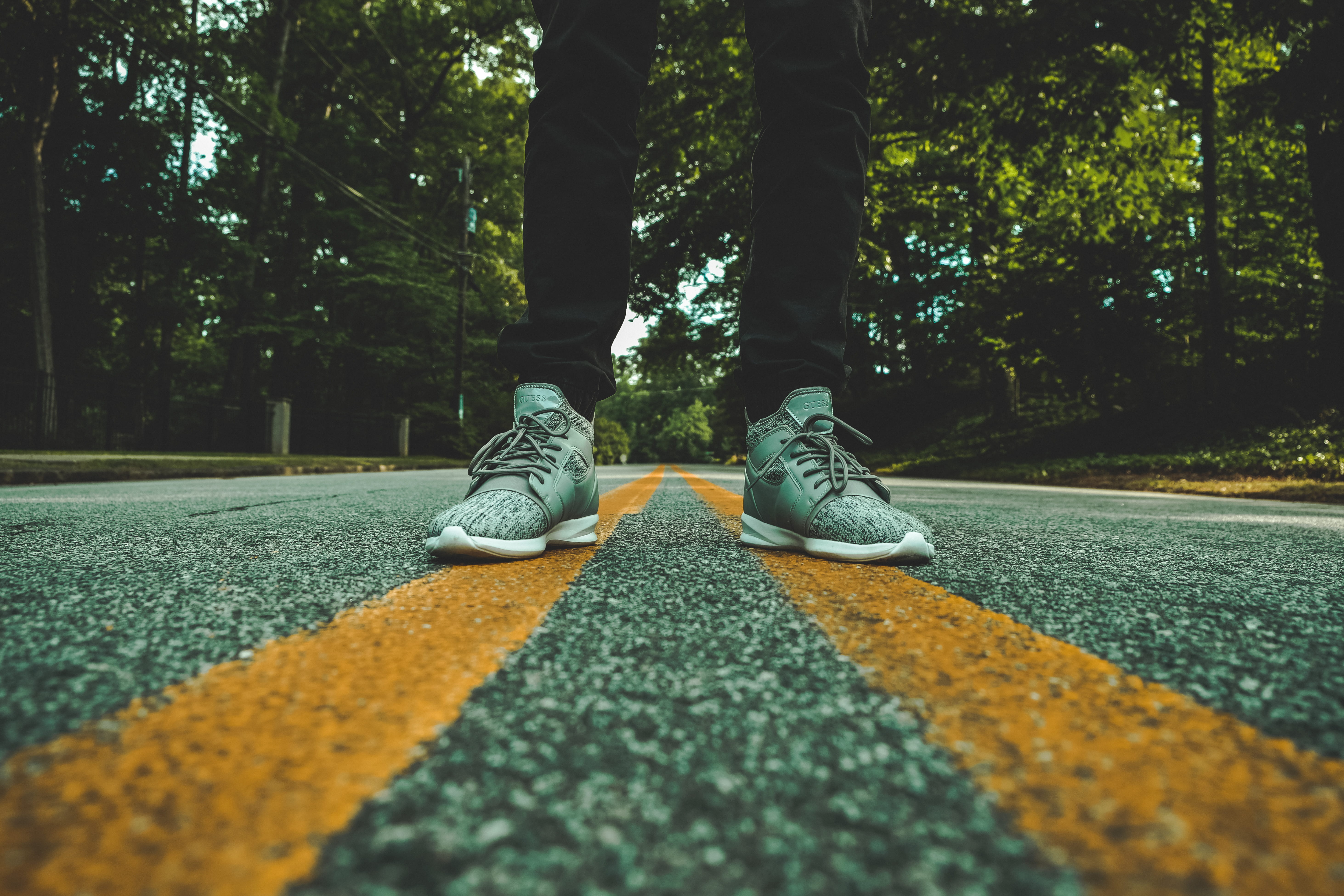 middle, human limb, pair, one person, street, outdoors, symmetry, concrete, nature, human foot, stand, standing, body part, lane, open road, person, lifestyles, HD Wallpaper