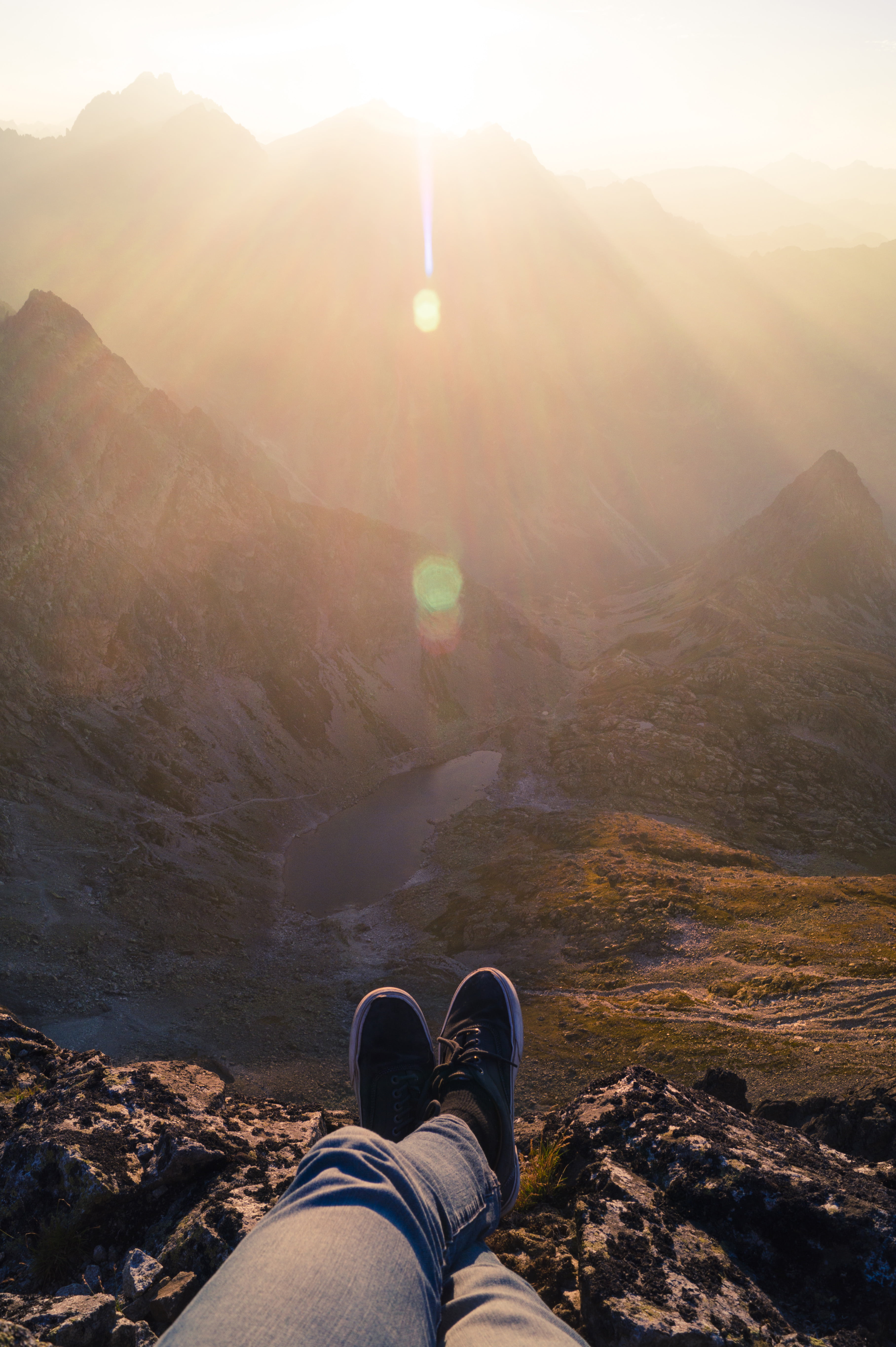 body part, landscape, shoe, personal perspective, black, 5K, human body part, human leg, one person, mountain range, pants, sunrise, mountains, sunbeam, Phone HD Wallpaper