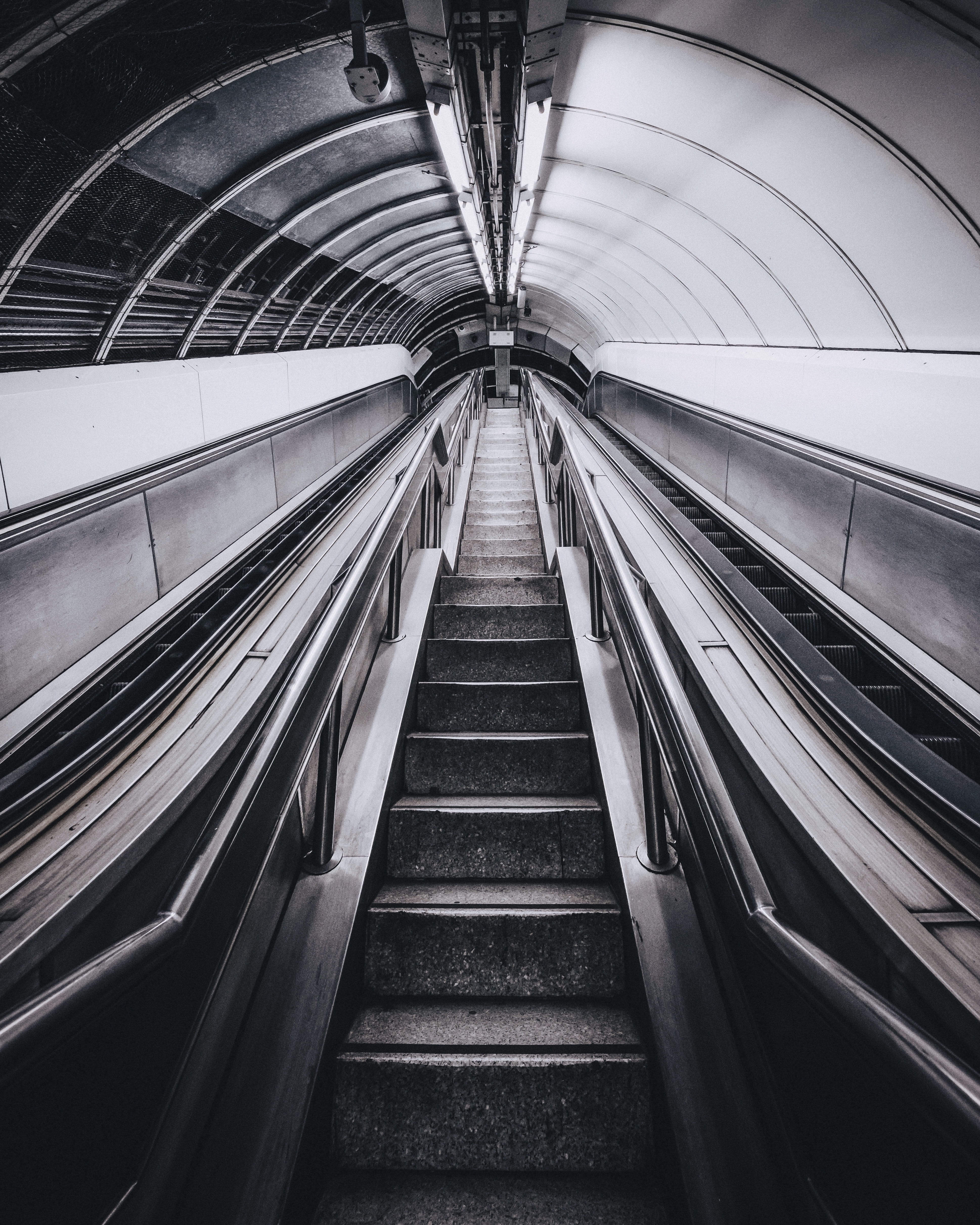 ceiling, subway station, railing, perspective, diminishing perspective, convenience, built structure, underground, looking up, tunnel, staircase, gray, Phone HD Wallpaper