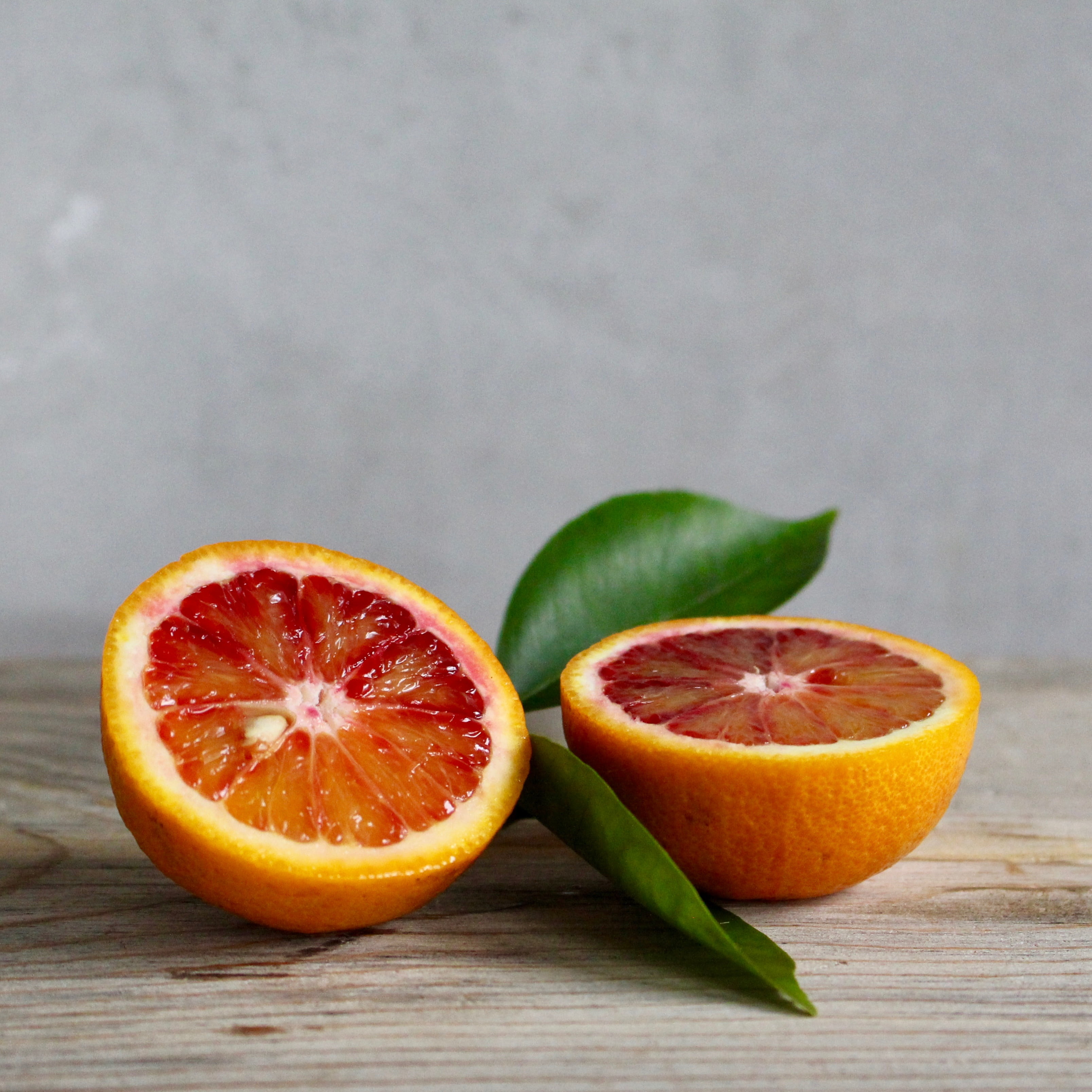 orange color, sliced, 2K, fruit, ripe, citrus fruit, food and drink, halved, organic, citrus, no people, food, wellbeing, table, indoors, tropical, red, Phone HD Wallpaper