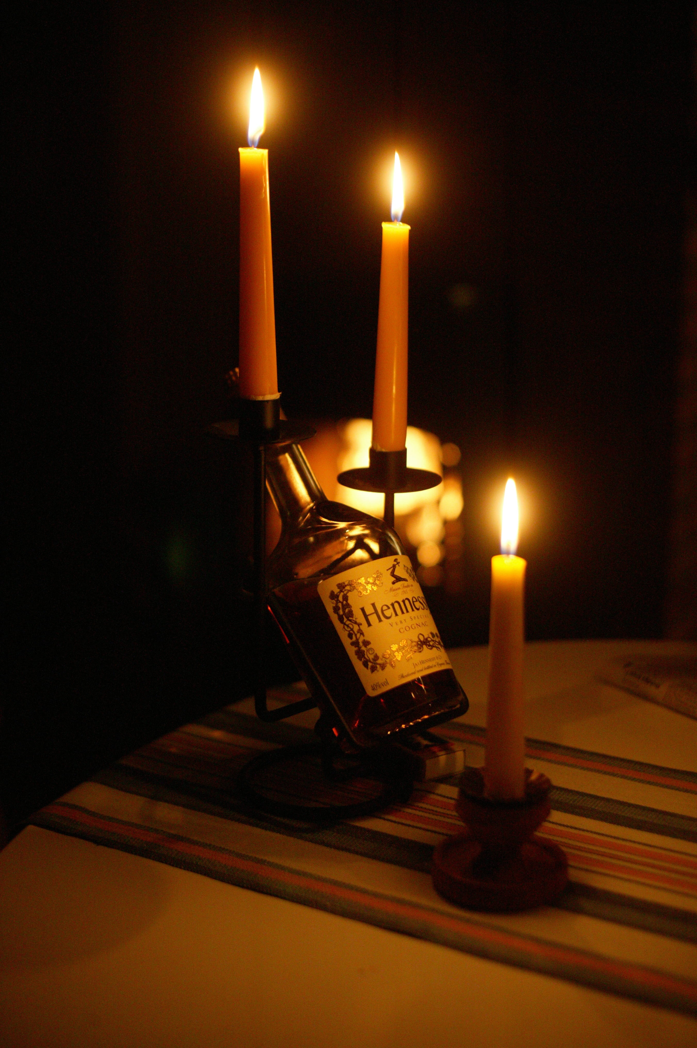 table, darkness, bottle, Cognac, atmosphere, candle, flame, close-up, black, Hennessy, burning, label, photography, Candles, 4K, darkroom, nature, fire, Phone HD Wallpaper