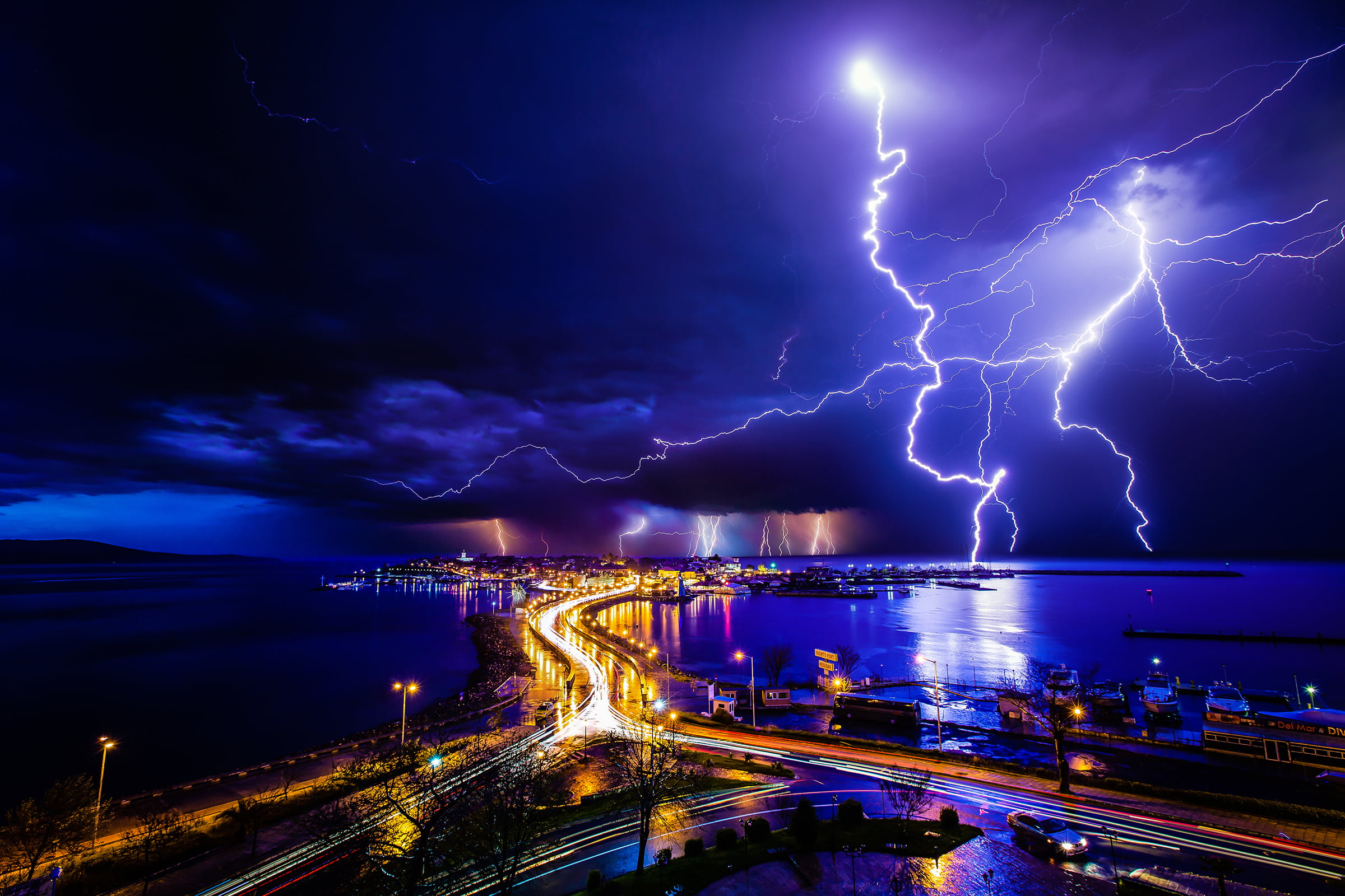 street, bright, landscape, dock, water, Ivan Slavov, overcast, long exposure, night, storm, glowing, city lights, lightning, 1080P, clouds, cityscape, HD Wallpaper