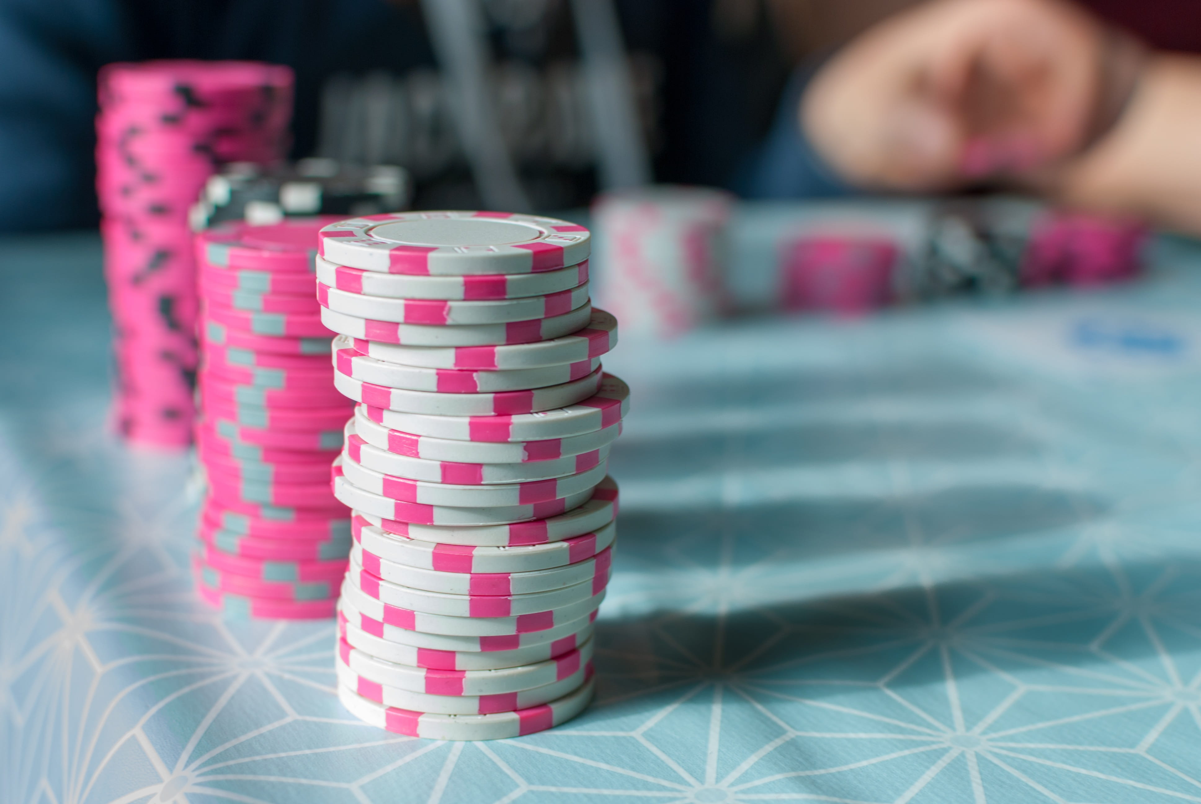 game, child, multi colored, table, poker, pink color, 4K, indoors, human hand, pink, leisure games, human body part, offspring, playing, white, hand, token, HD Wallpaper