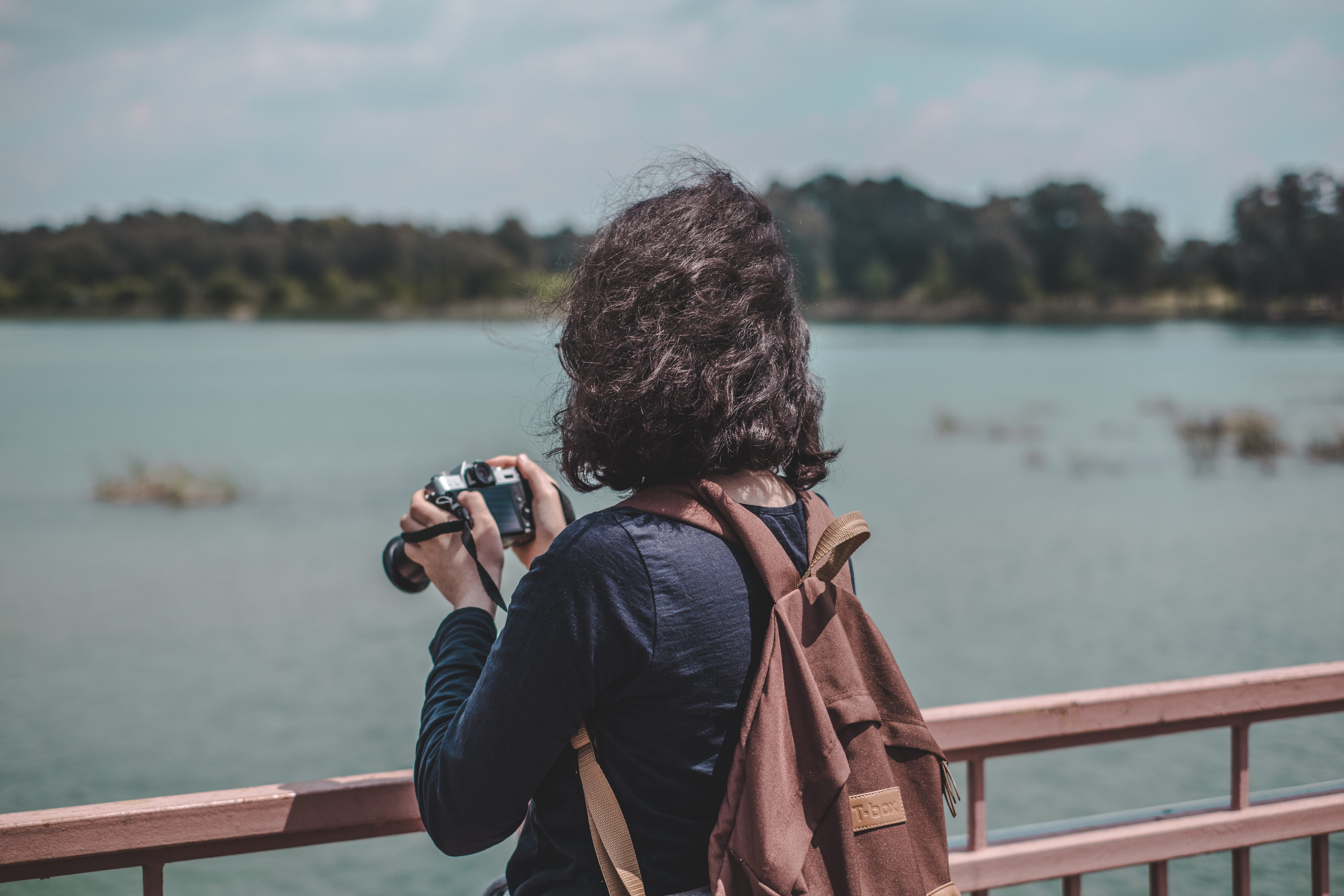 photography themes, new, women, digital camera, standing, hairstyle, looking at view, warm clothing, lake, storm, person, real people, sitting, slr camera, HD Wallpaper