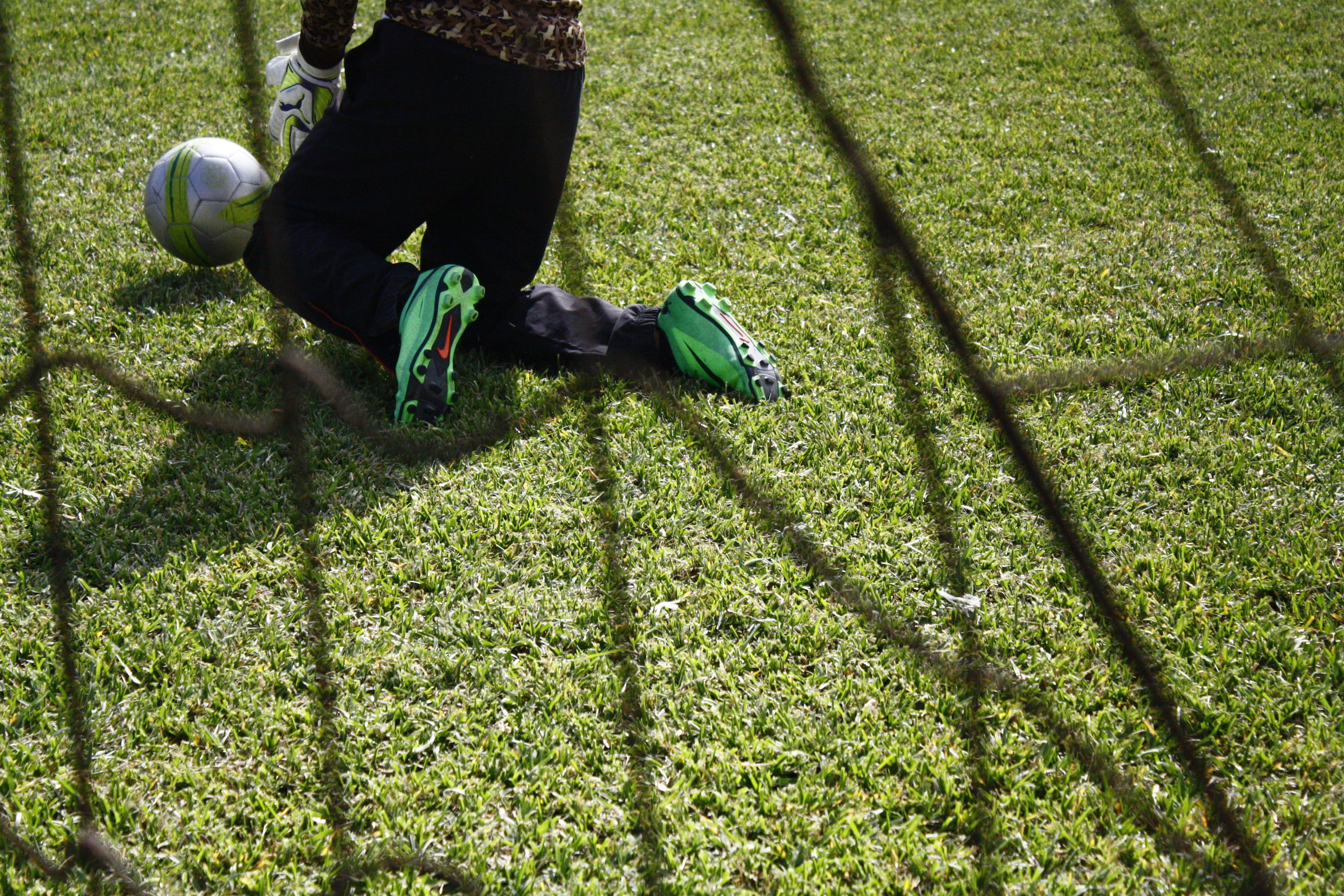 one person, jump, leisure activity, shortcut, human body part, plant, real people, shadow, sport, human leg, porter, air, outdoors, football, green color, HD Wallpaper