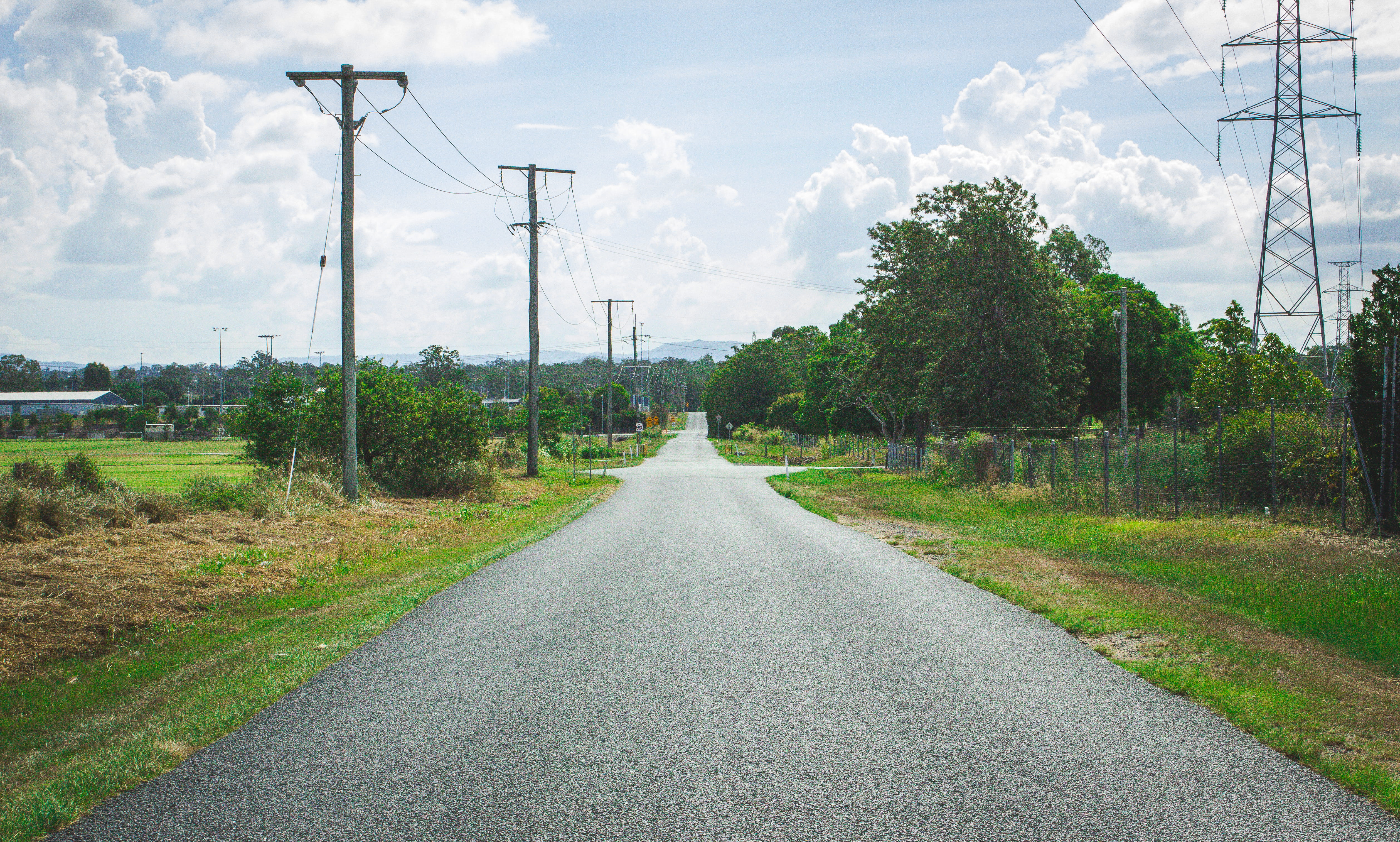 path, the way forward, telephone line, asphalt, 4K, no people, gravel, transportation, electricity, direction, housing, electric transmission tower, technology, HD Wallpaper