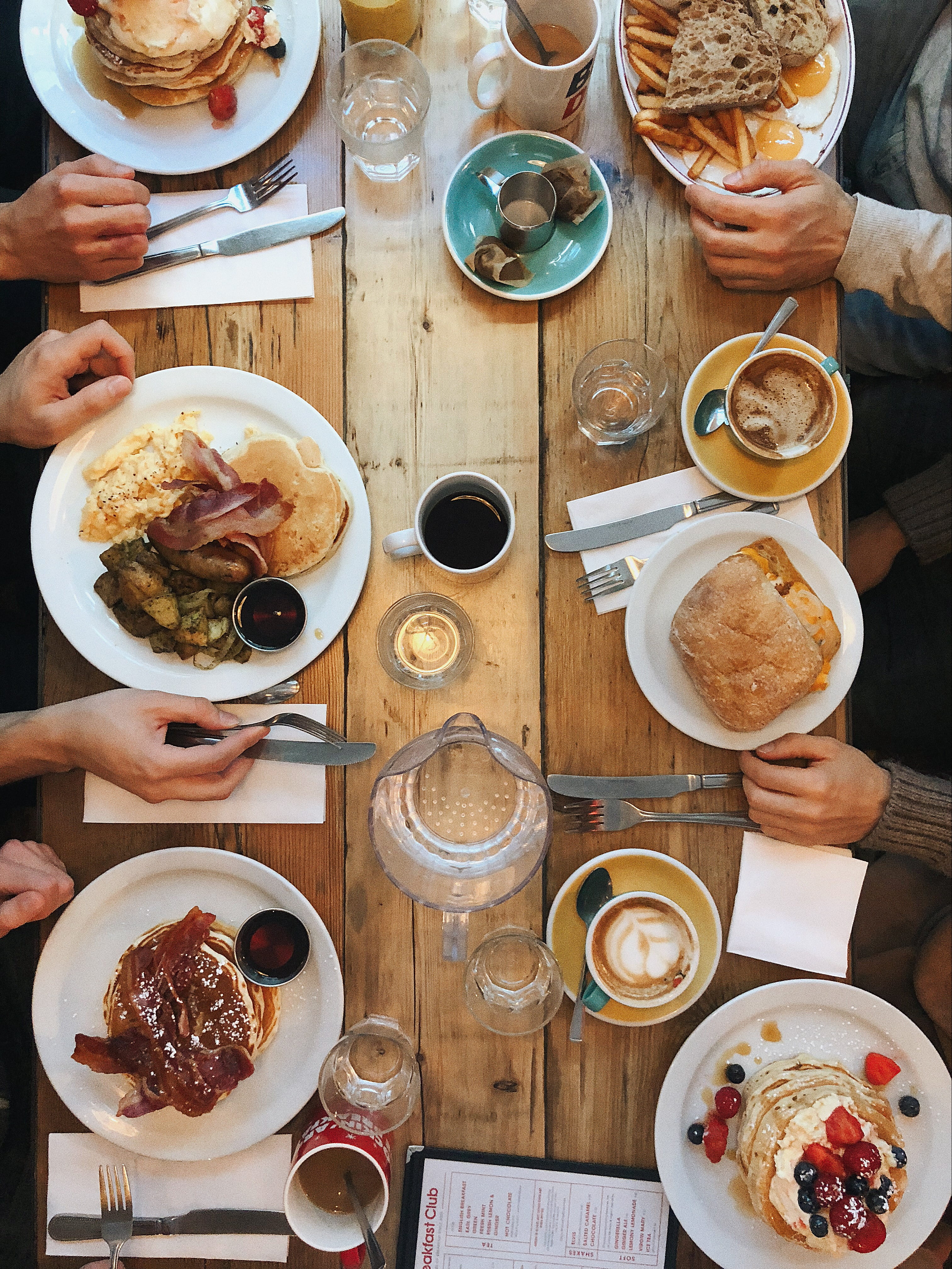 dinner, 4K, dining, table, food, human body part, wood, high angle view, wooden, household equipment, glass, togetherness, friendship, spoon, breakfast, Phone HD Wallpaper