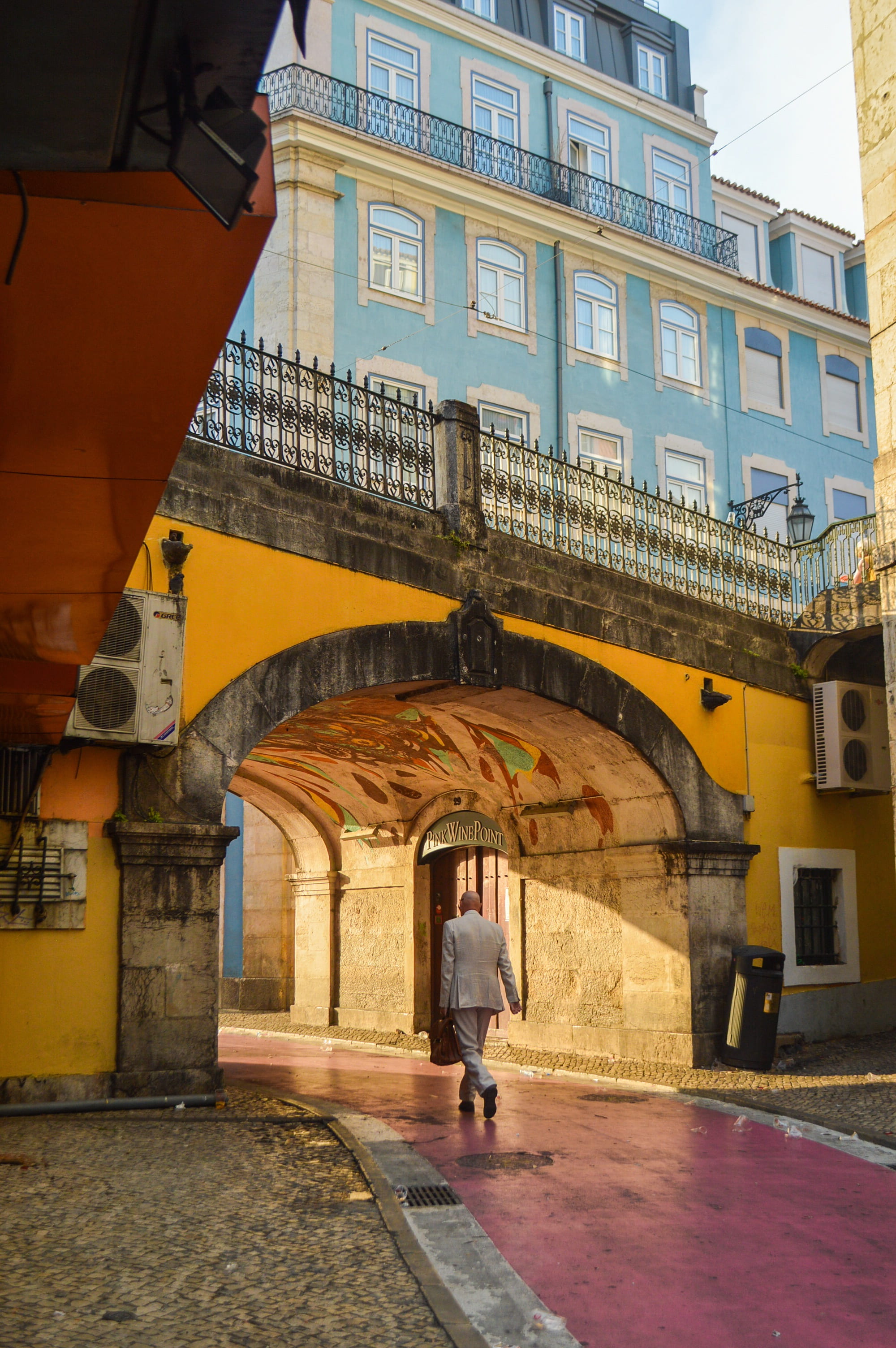 men, women, one person, downtown, built structure, real people, umbrella, building, city, portugal, outdoors, pink street, street, architecture, lifestyles, Phone HD Wallpaper