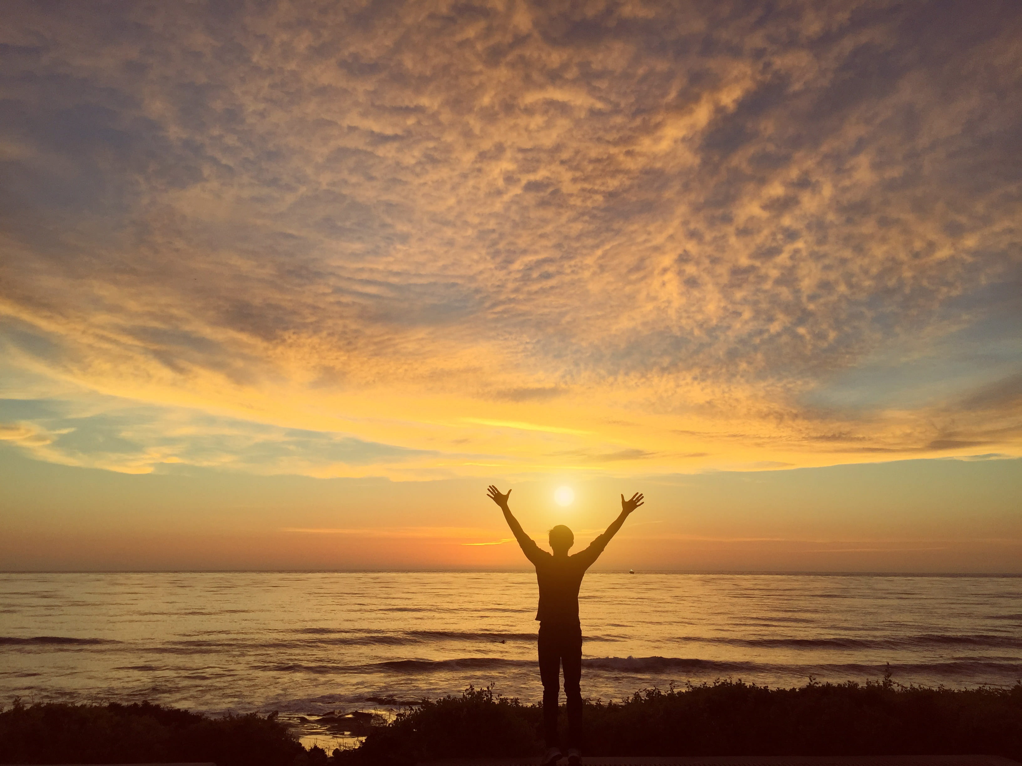 sunset, water, beauty in nature, island, human arm, sky, horizon over water, land, 2K, one person, cloud - sky, sea, beach, mesmerizing, man, standing, HD Wallpaper