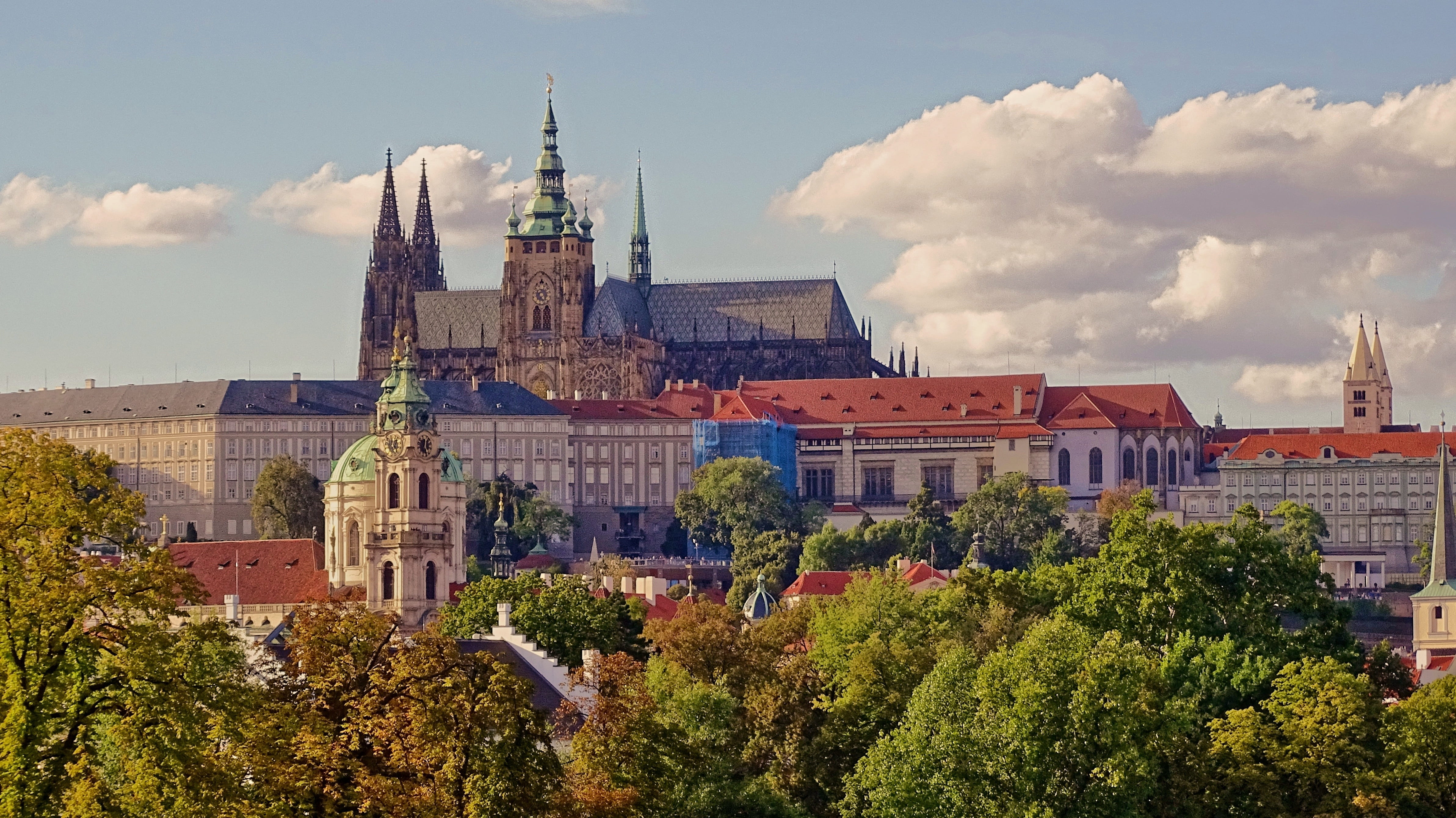 place of worship, 4K, city, travel, prague castle, no people, clock, tree, sky, religion, cloud - sky, building, tower, history, built structure, plant, HD Wallpaper