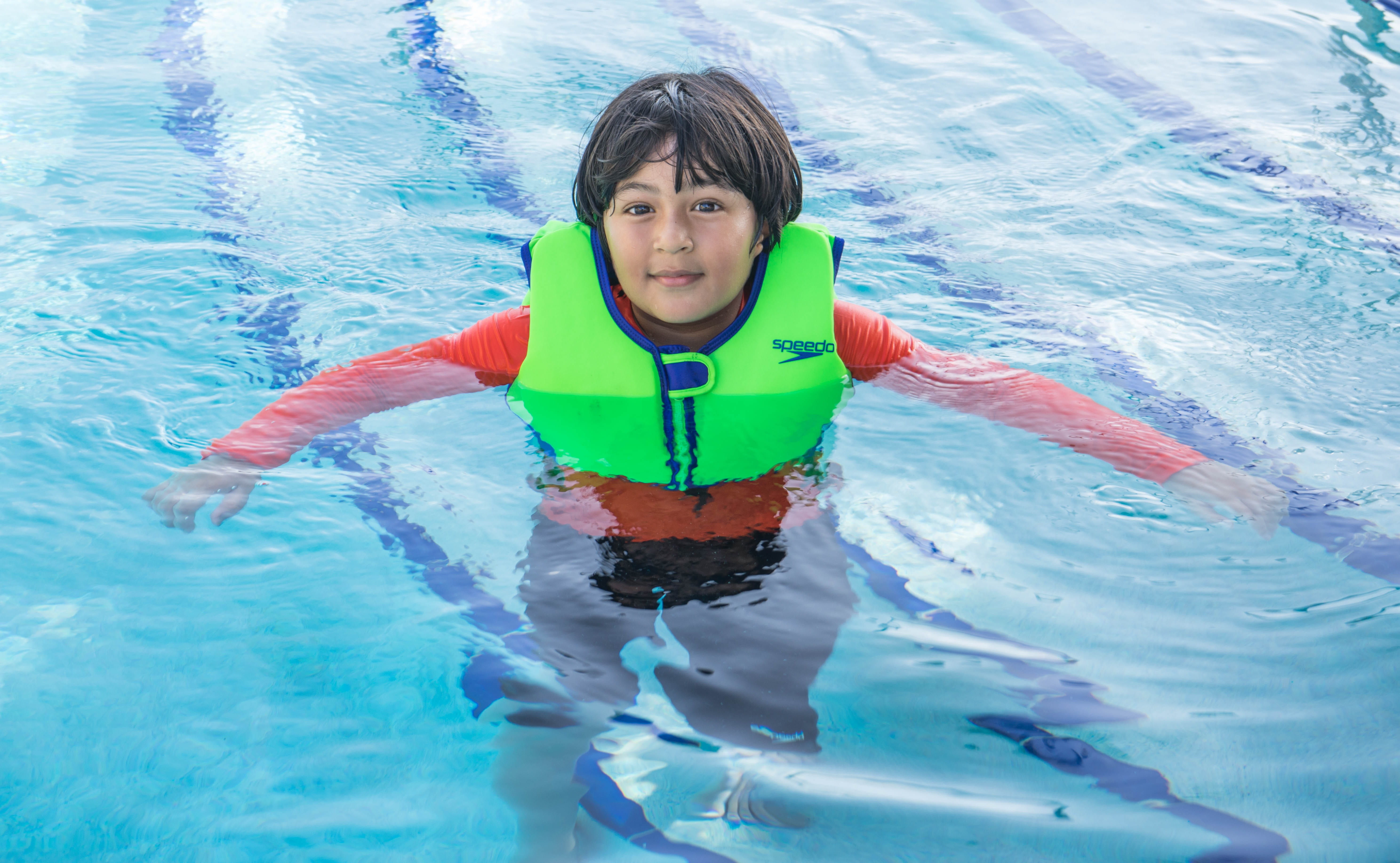 portrait, innocence, childhood, front view, day, safeguard, lifestyles, floating on water, green, high angle view, looking at camera, life preserver, nature, HD Wallpaper