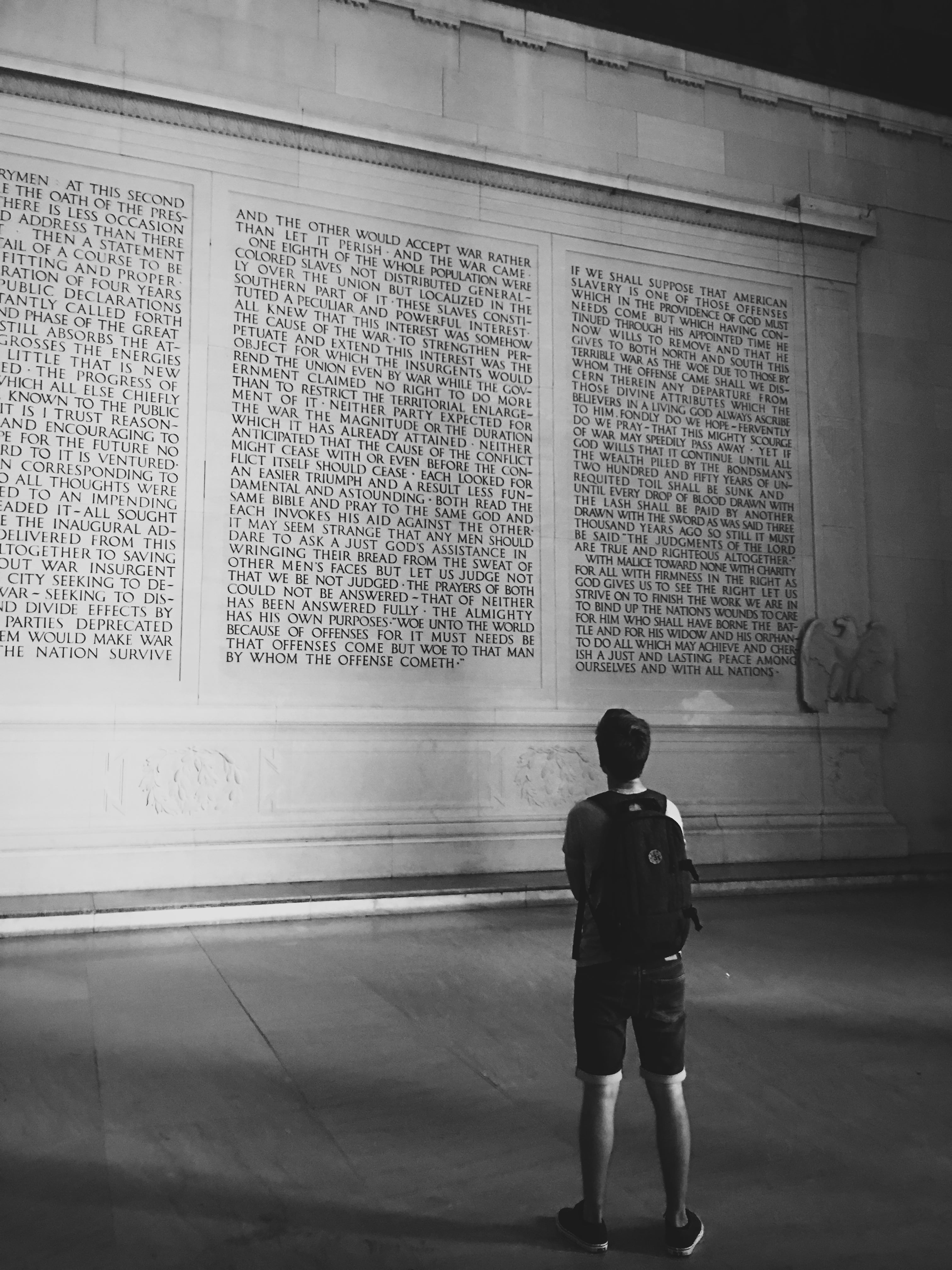 shorts, real people, wall, males, shadow, historical, administration, building exterior, one person, man, architecture, reading, innocence, wall - building feature, Phone HD Wallpaper