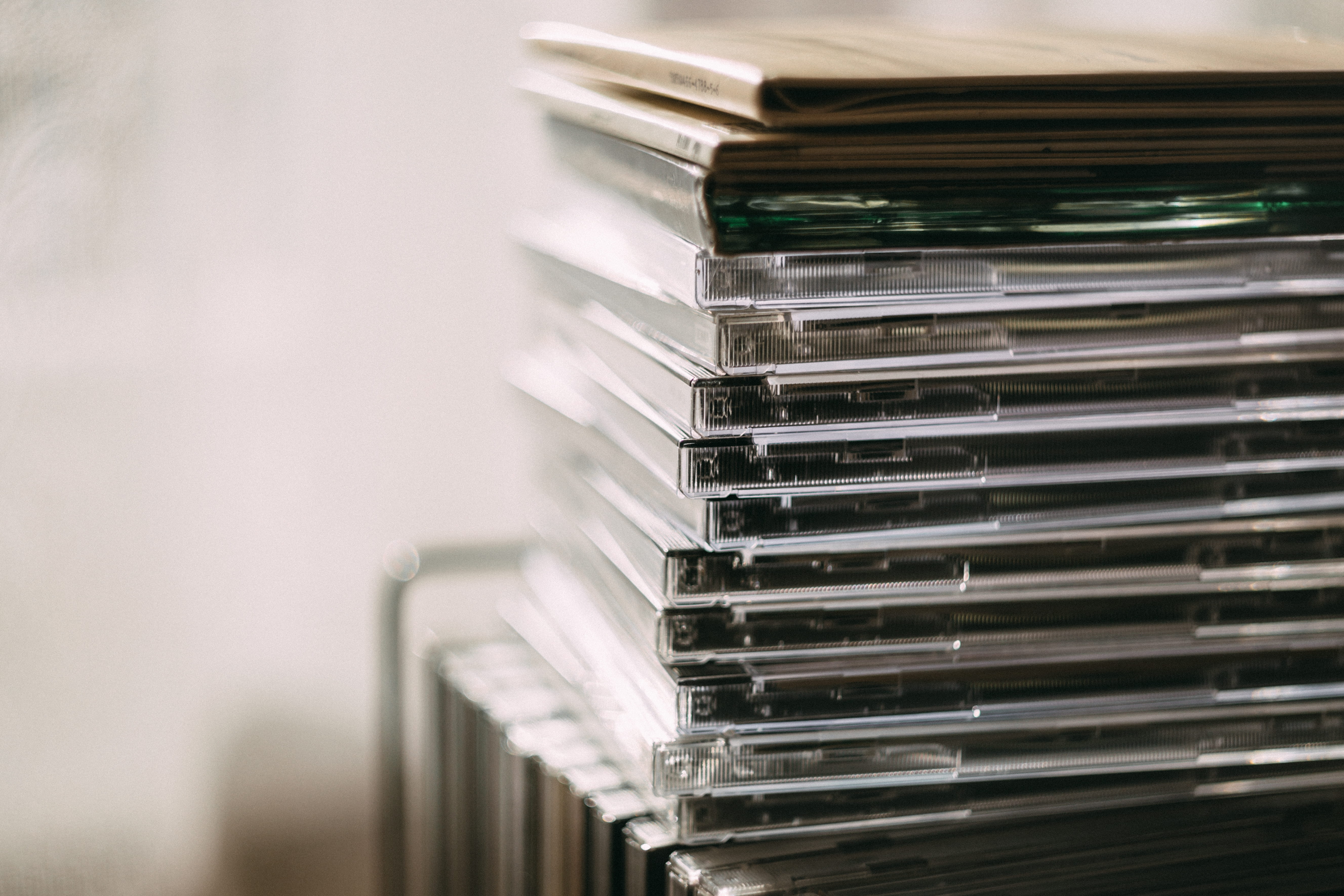 still life, education, pile, music, household equipment, cd, 5K, arts culture and entertainment, absence, blur, close-up, cases, abundance, no people, HD Wallpaper