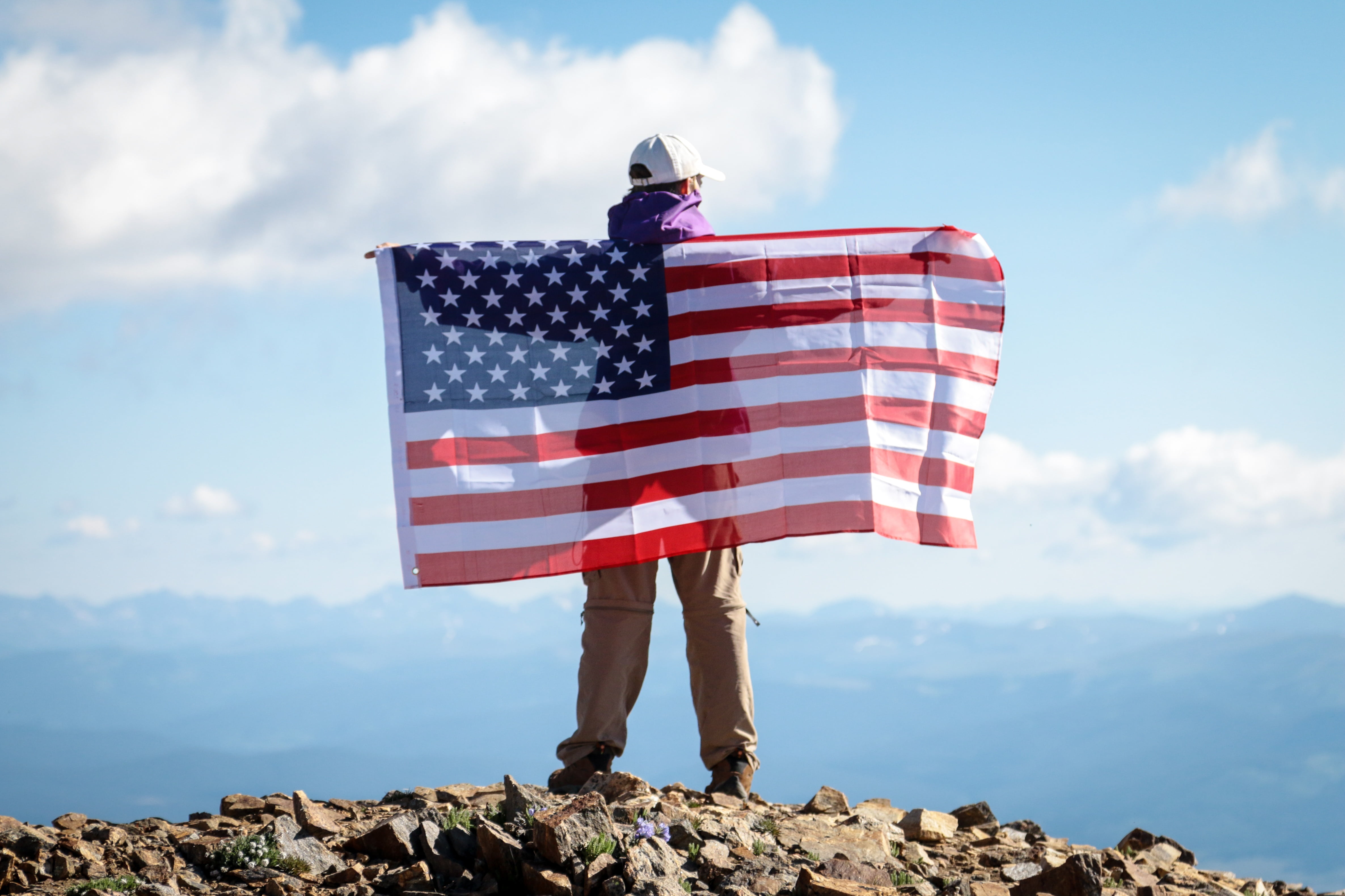 beauty in nature, solid, striped, man, sea, holding, banner, 4K, patriotism, outdoors, one person, red, national, real people, standing, white, mountain, HD Wallpaper