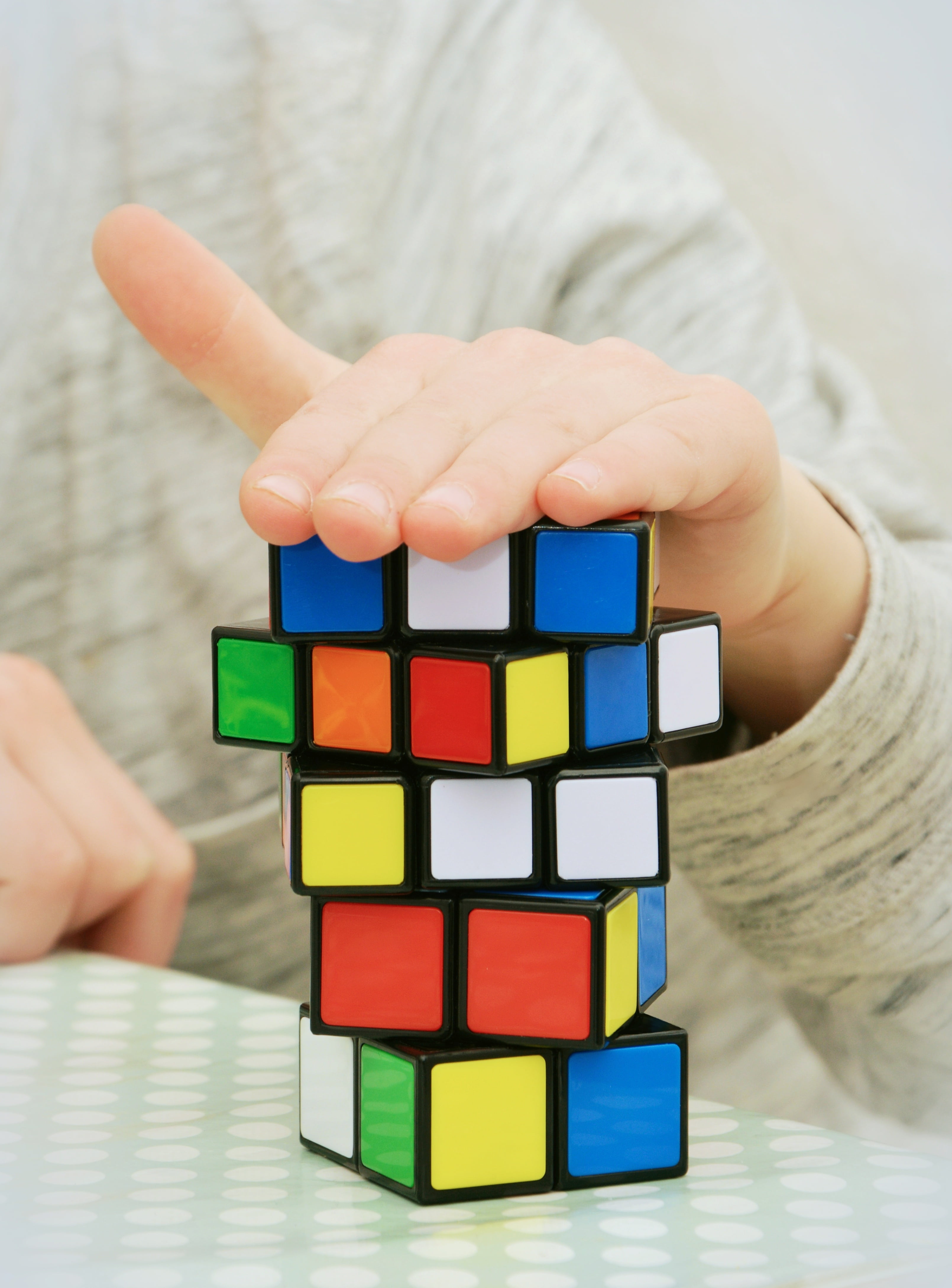 human body part, large group of objects, strategy, concentration, unrecognizable person, hobby, magic cube, indoors, toy block, hand, 4K, leisure activity, Phone HD Wallpaper