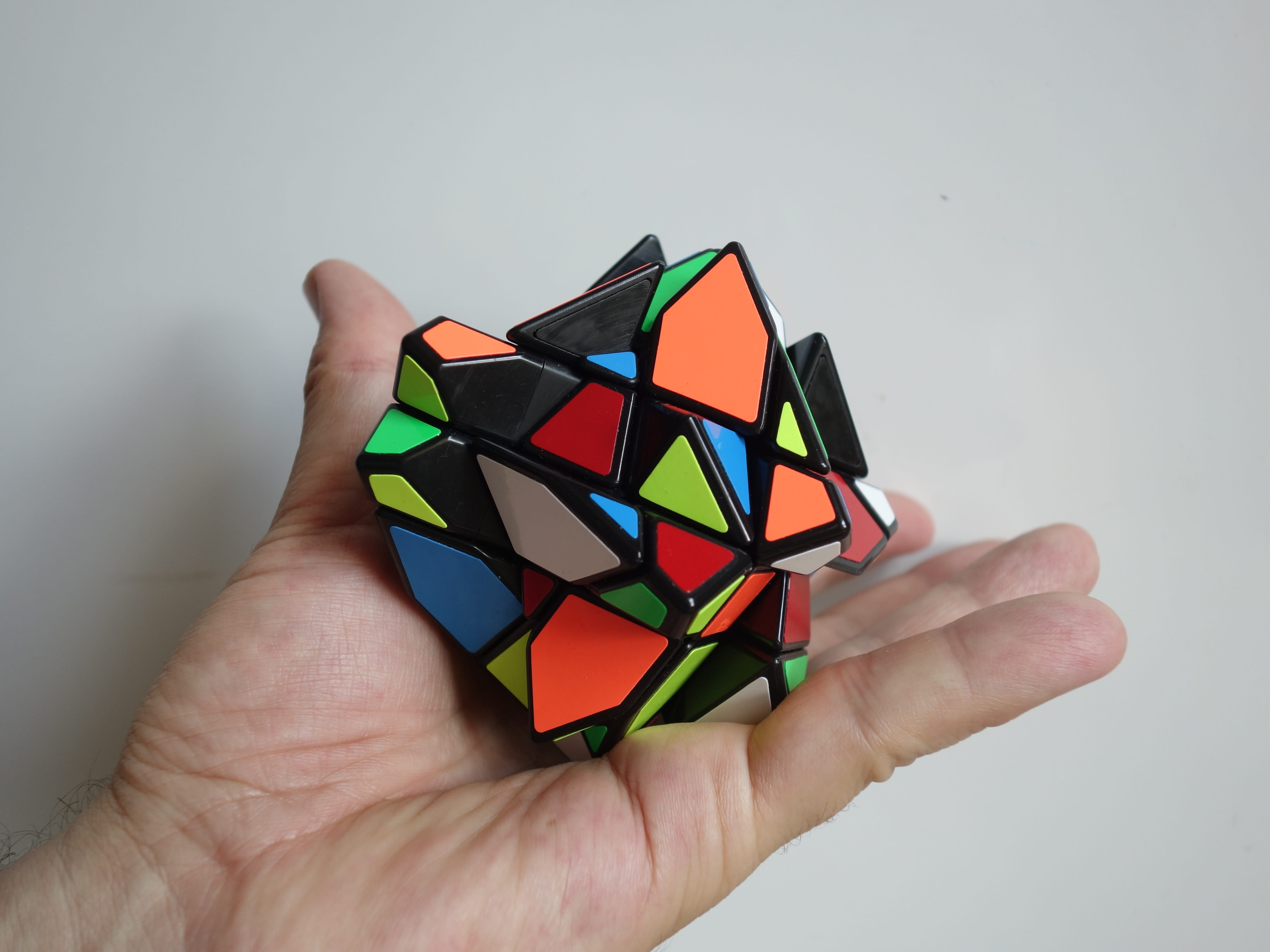 human hand, s, white background, holding, Hand, unrecognizable person, colorful, gray, 4K, difficult, one person, Toys, rubik, trapeze, personal perspective, HD Wallpaper