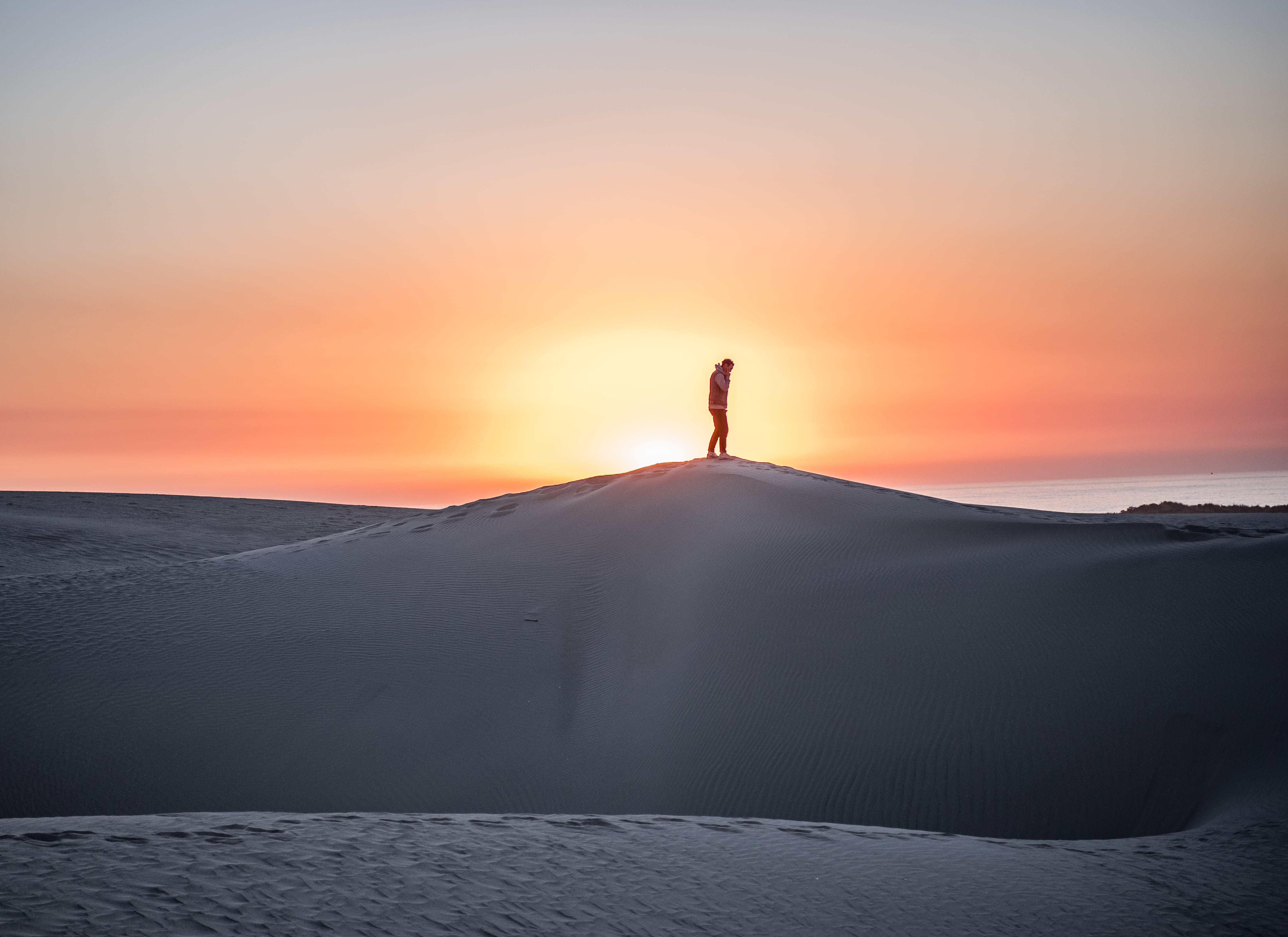 beauty in nature, thought, sun, love, ocean, peak, horizon, leave, standing, environment, stand, land, one person, explore, outdoors, silhouette, sunlight, HD Wallpaper
