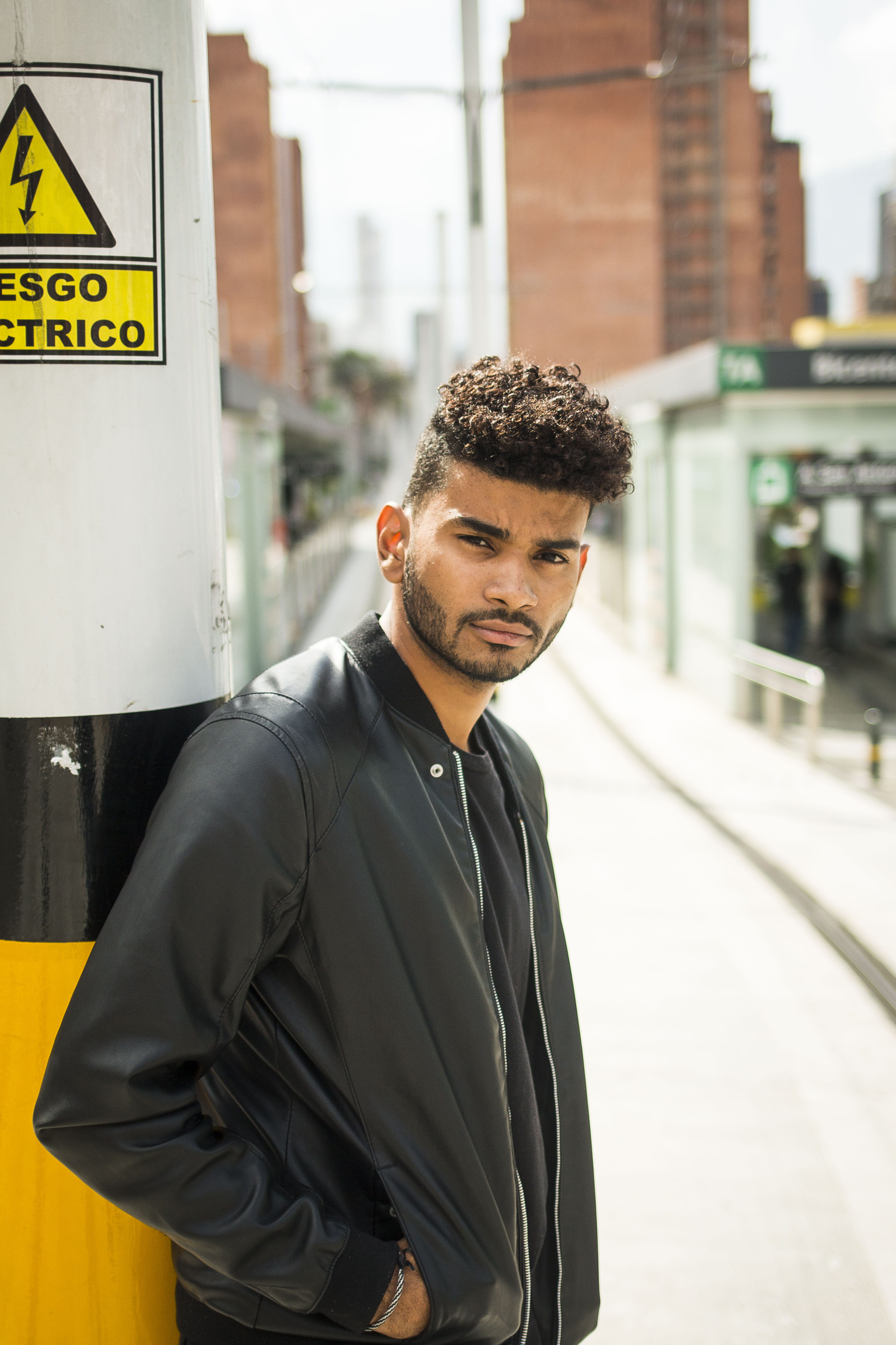 s, looking at camera, real people, person, human, clothing, coat, rail transportation, front view, decided, apparel, pedestrian, young men, rude, one person, Phone HD Wallpaper