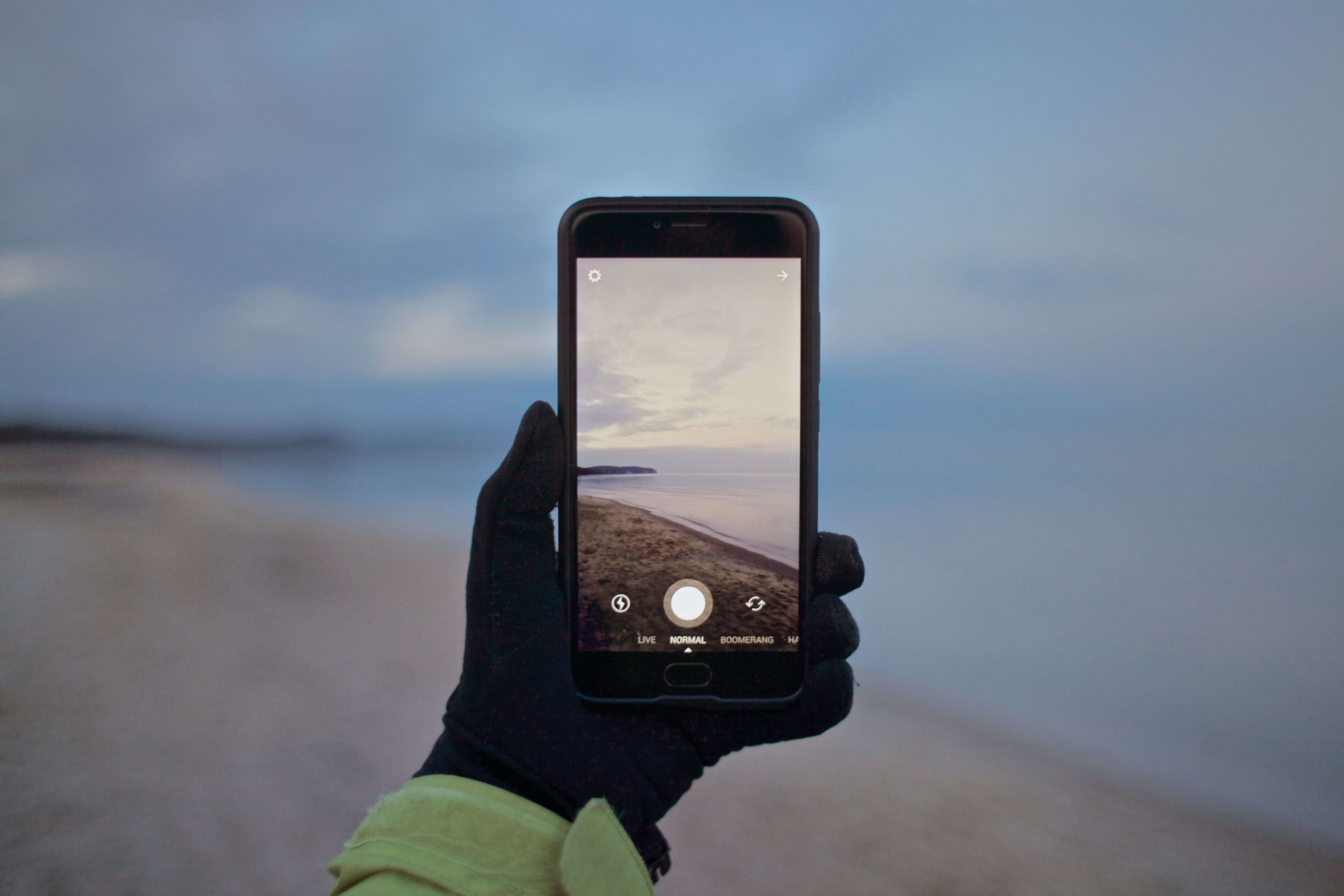 black, hand, sky, iphone, phone, holding, photography themes, ocean, screen, 5K, water, mobile phone, reflection, focus on foreground, travel, sea, cellphone, HD Wallpaper