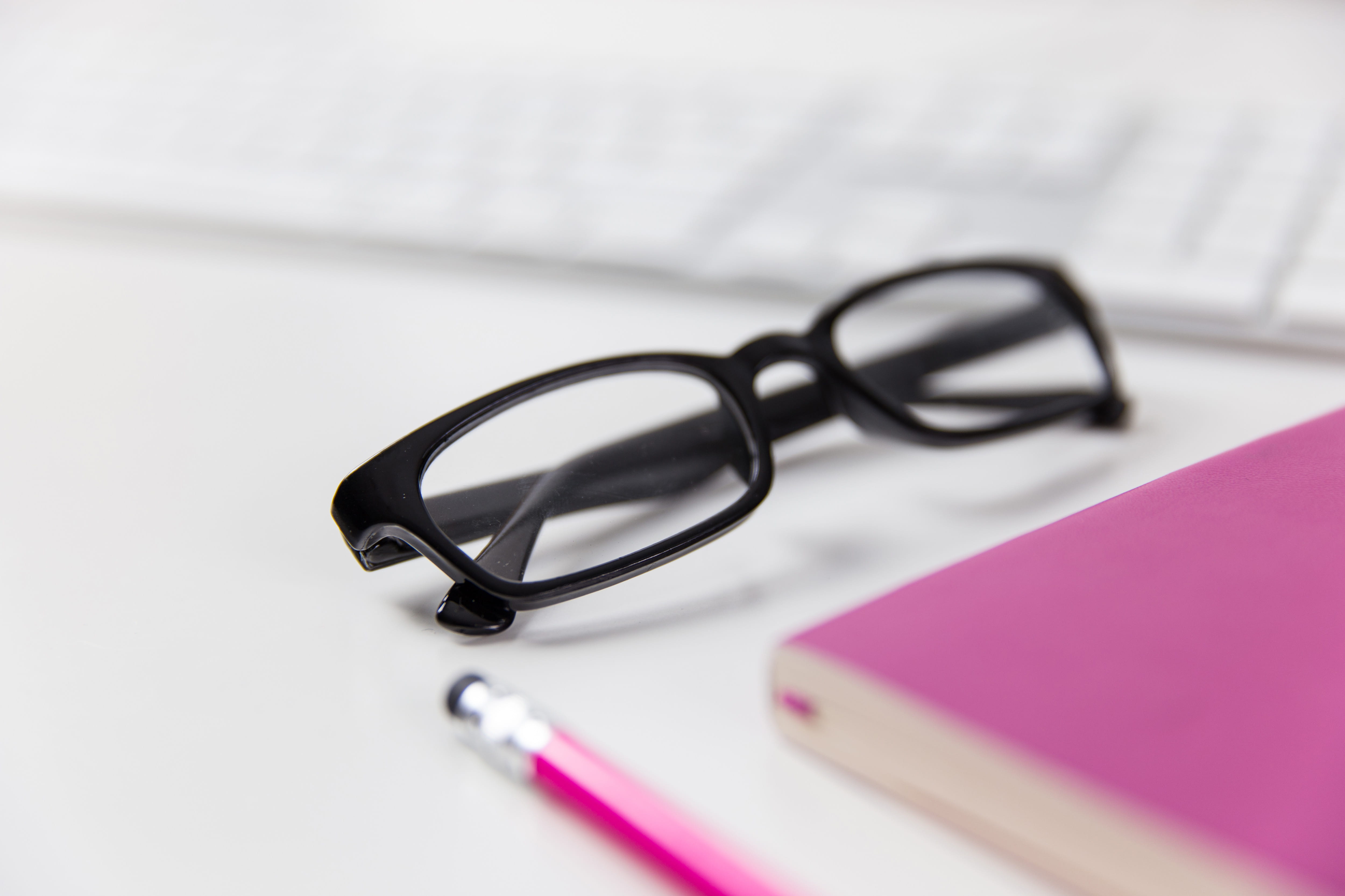 table, focus on foreground, equipment, simplicity, books, studio shot, office, keyboard, pink color, desk, 4K, still life, education, document, Reading glasses, HD Wallpaper