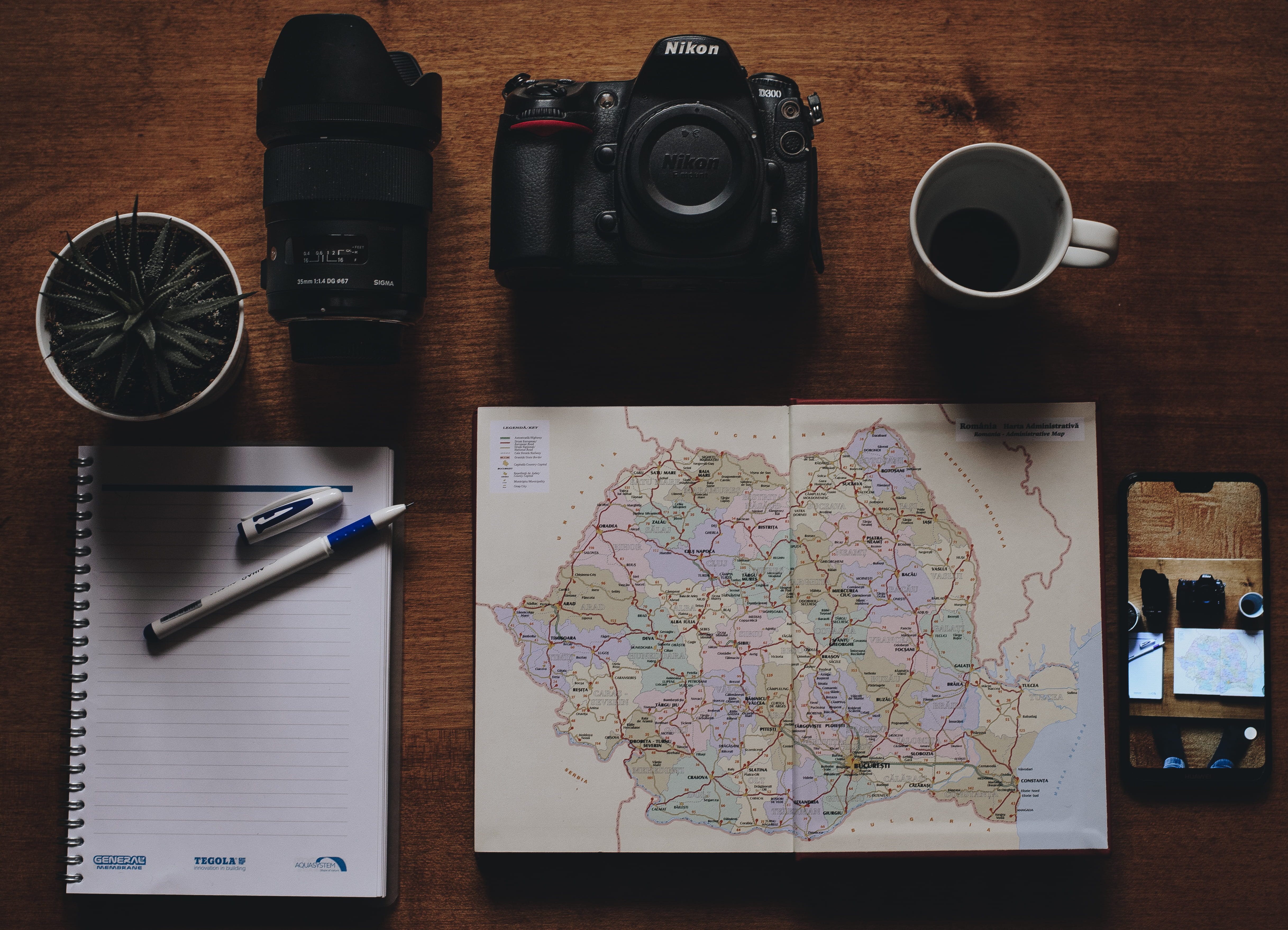 digital camera, furniture, planning, dslr, desk, direction, atlas, mobile phone, coffee cup, tabletop, map, exploration, plot, phone, no people, electronics, HD Wallpaper