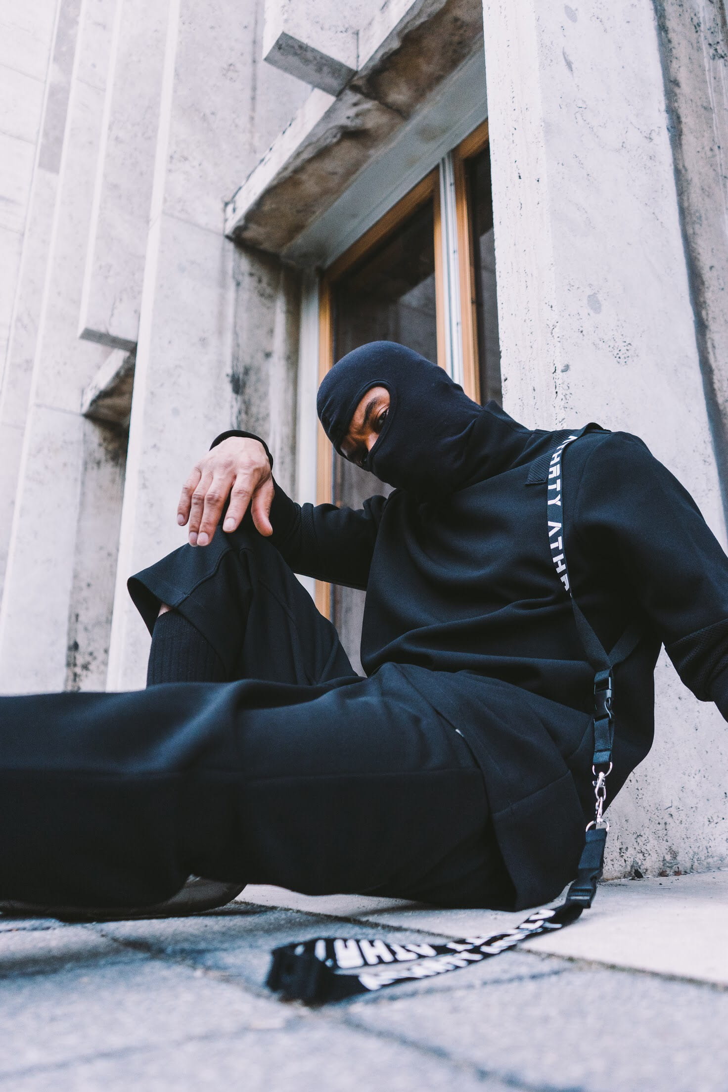 social issues, architecture, built structure, sitting, urban, young adult, clothing, hood - clothing, mask, front view, shoulder, leisure activity, real people, Phone HD Wallpaper