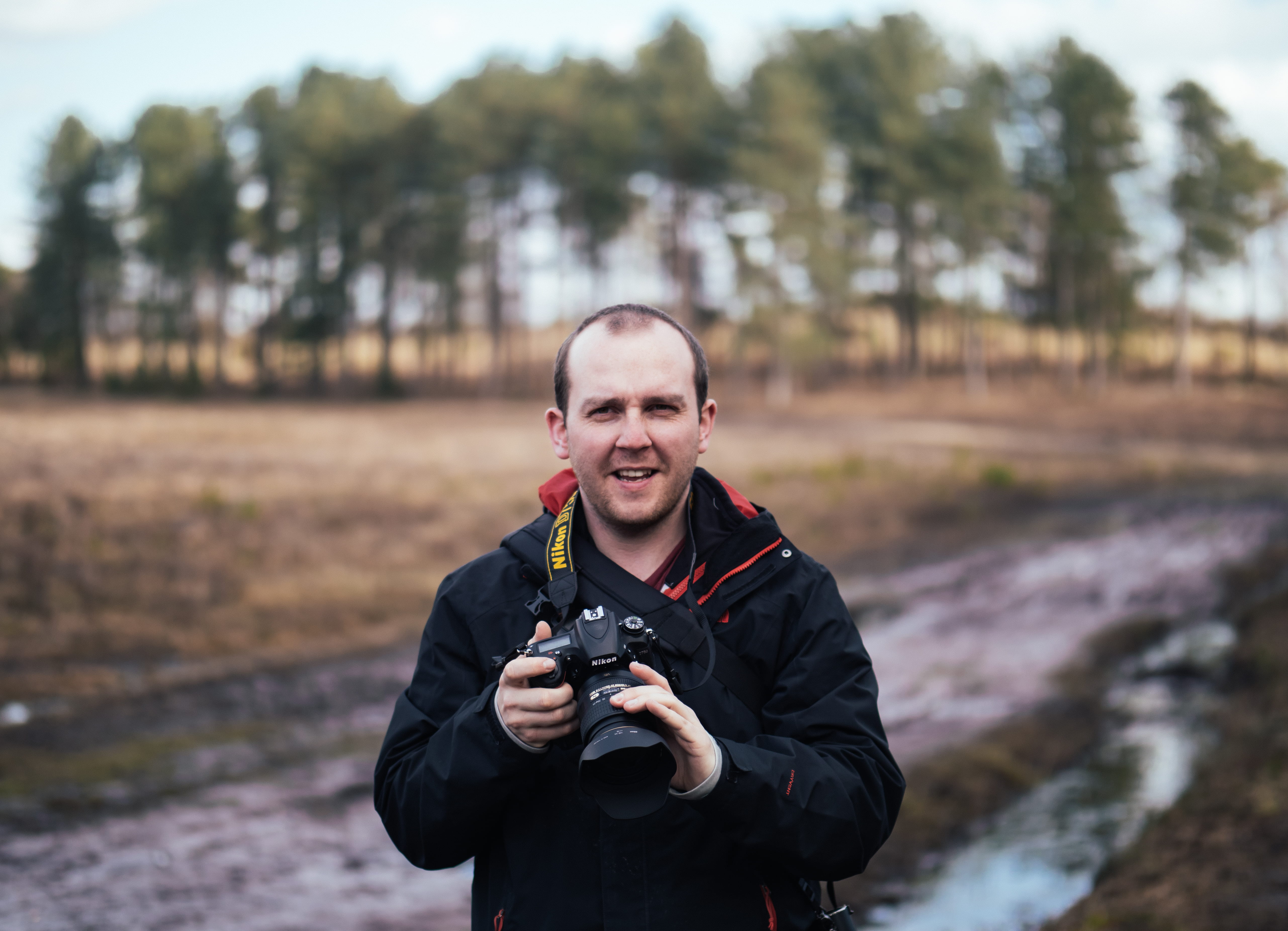 focus, lanyard, looking at camera, camera, dlsr, holding, daytime, photography, man, road, front view, warm clothing, digital camera, black, emotion, selective, HD Wallpaper