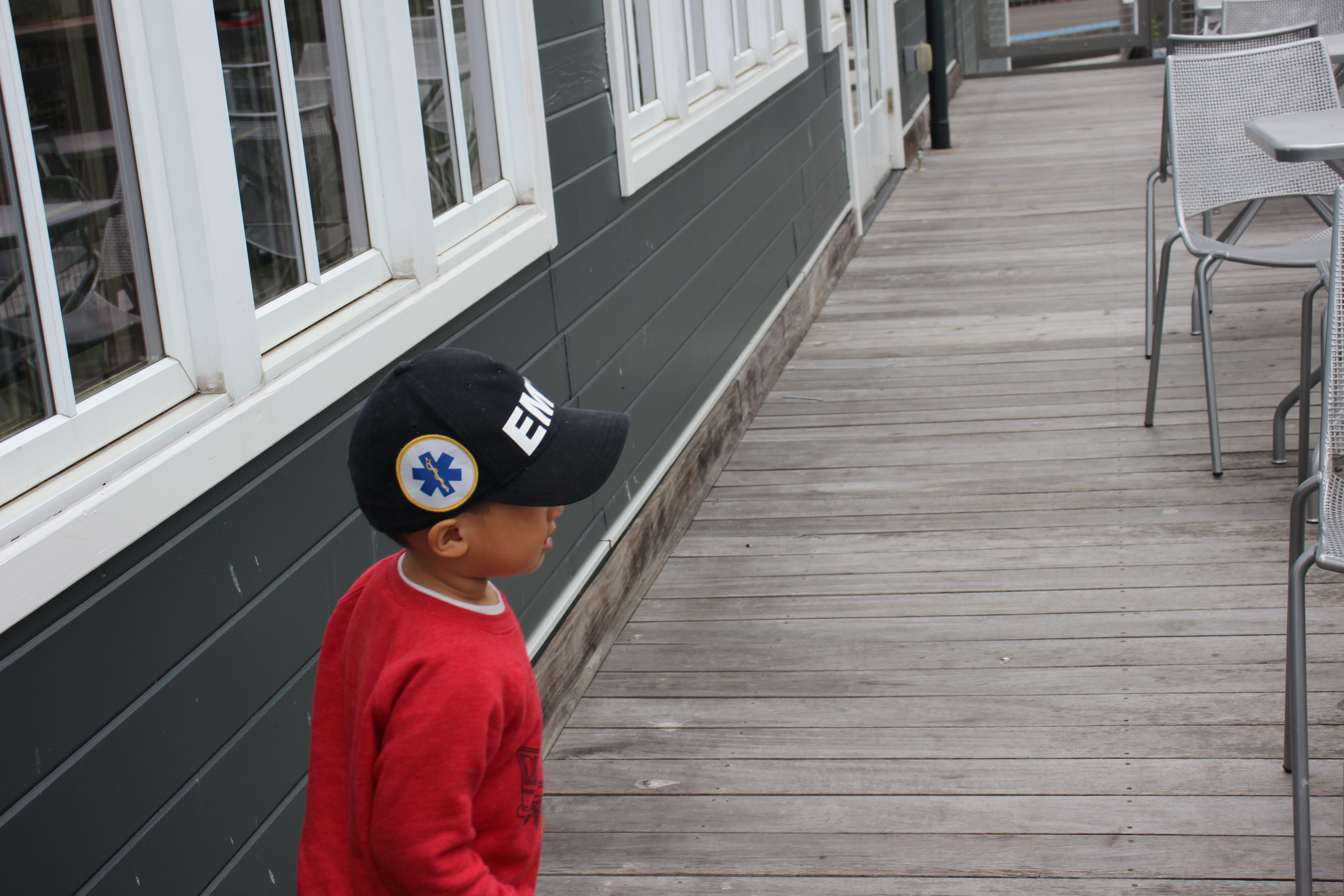 human, boardwalk, long sleeve, day, plan, sleeve, cap, child, waist up, porch, males, men, deck, apparel, chair, hat, childhood, three quarter length, built structure, HD Wallpaper