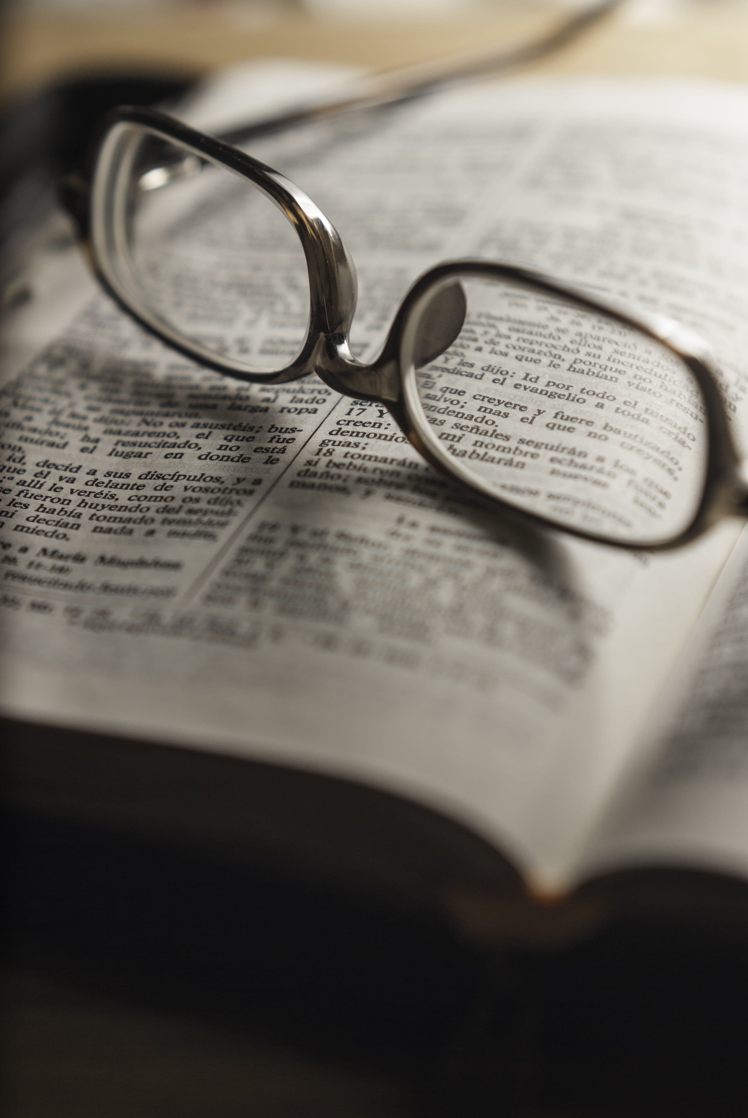 tilt, communication, table, lettering, publication, no people, christianity, text, still life, frames, lens, photography, open, 4K, close-up, indoors, Phone HD Wallpaper