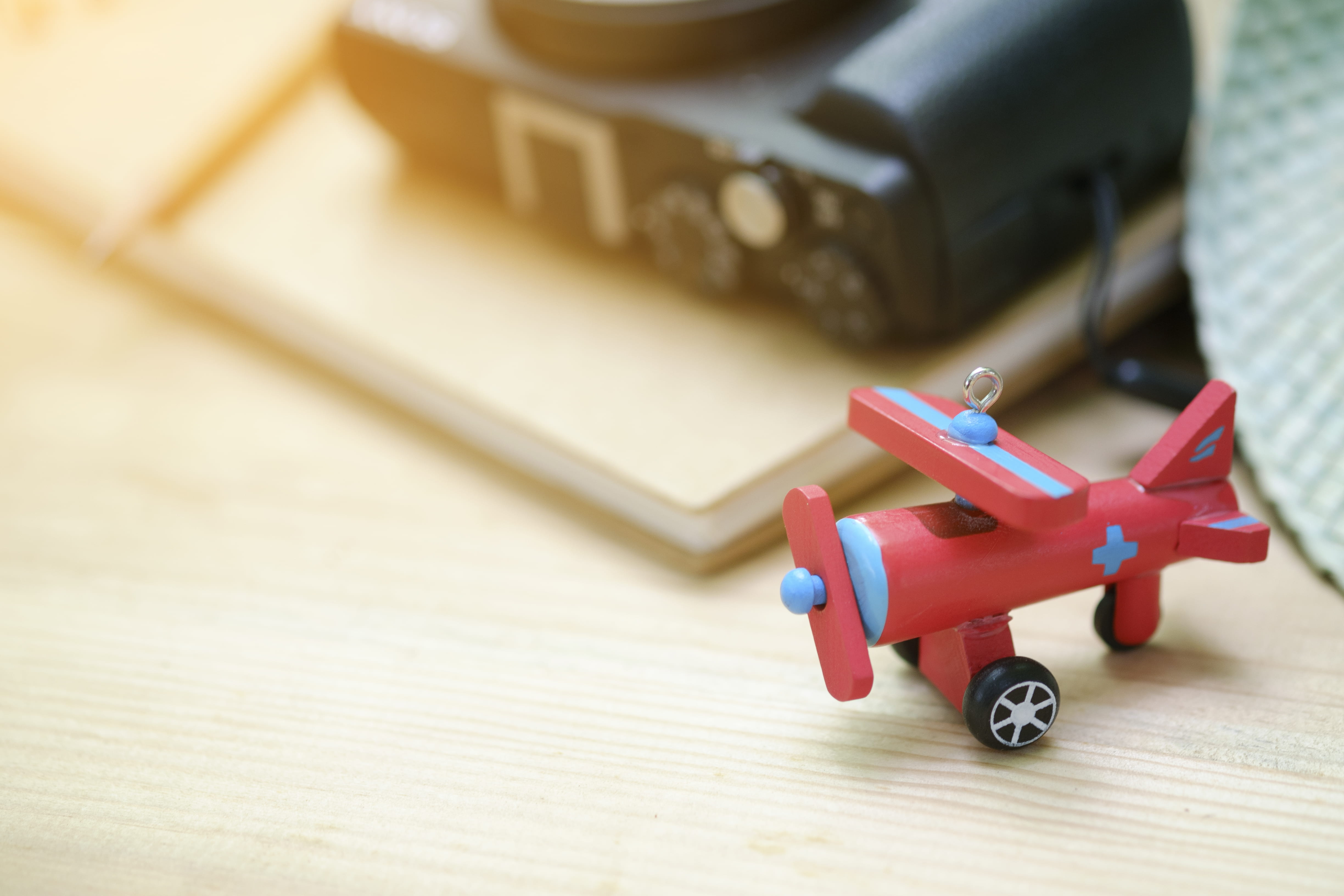 day, 4K, items, air vehicle, hat, airplane, selective focus, blur, focus on foreground, objects, indoors, wood, representation, wooden, still life, colors, HD Wallpaper