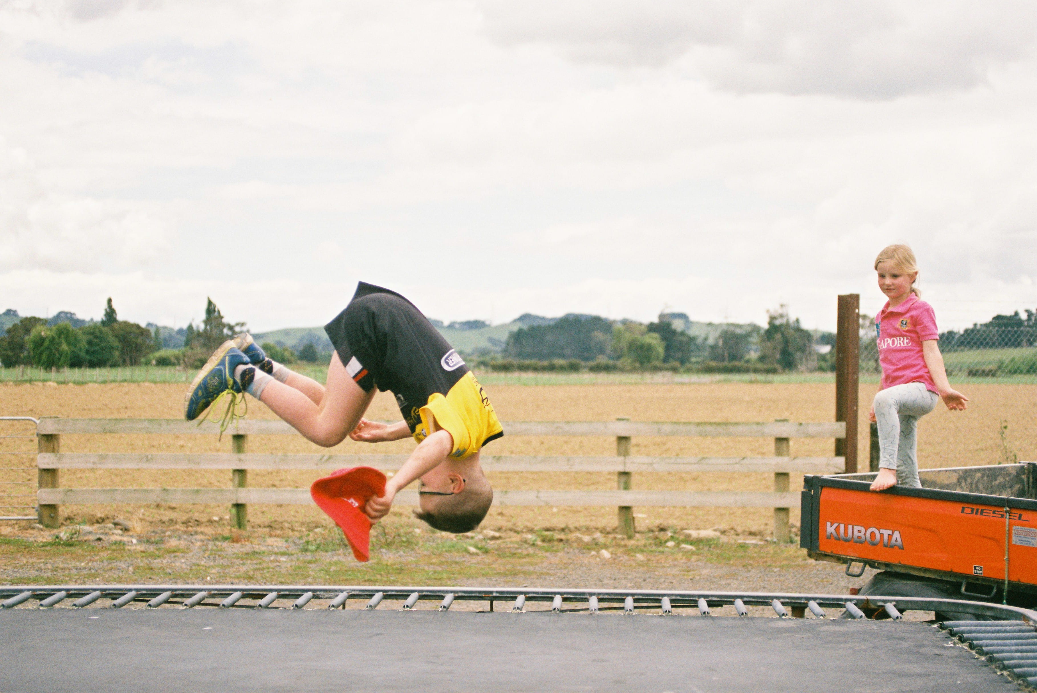 running track, asphalt, human, pants, boy, tarmac, two people, high jump, childhood, shoe, men, outdoors, child, lifestyles, sports, nature, sport, front, HD Wallpaper