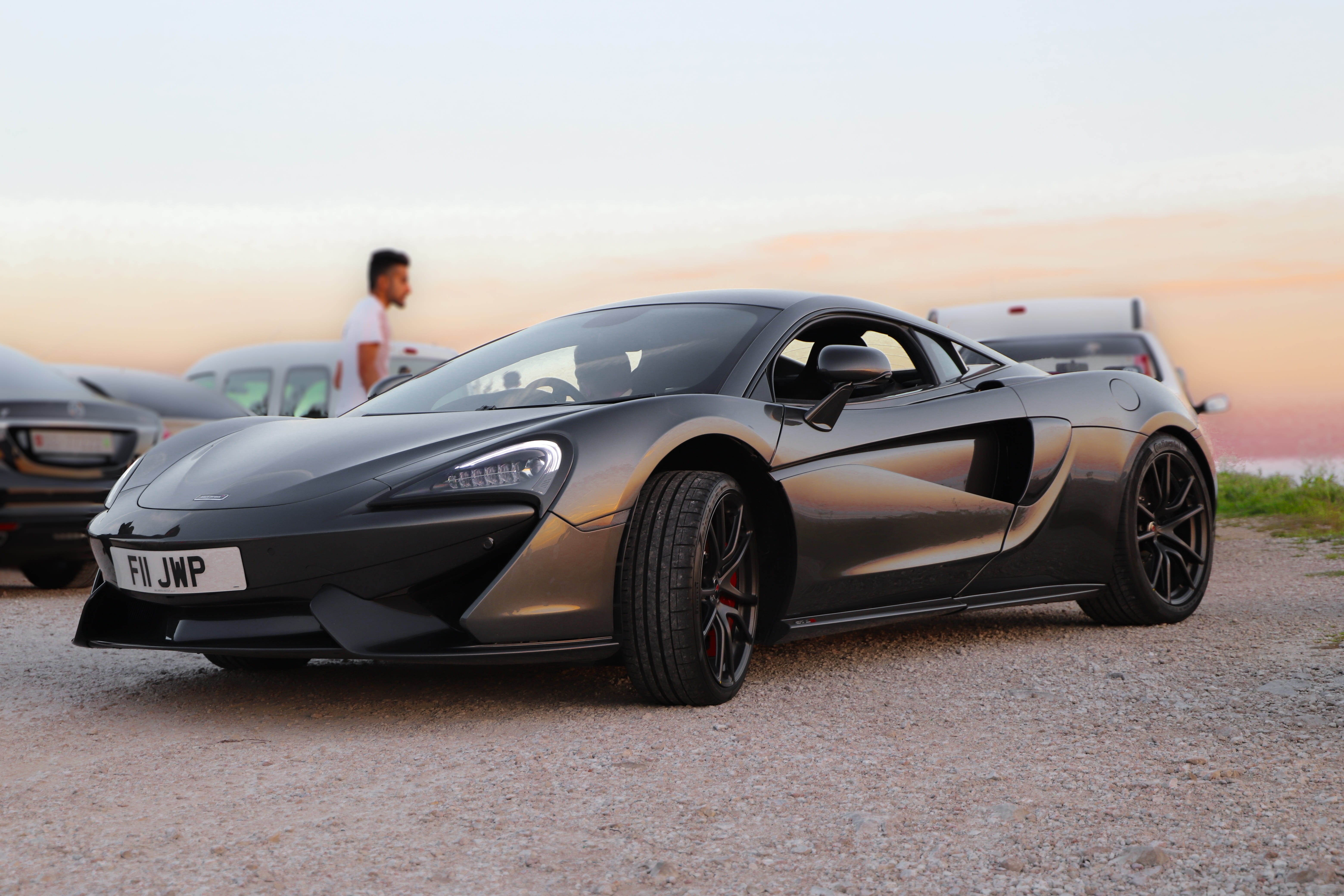 outdoors, sports car, land vehicle, expensive, mclaren 570, 5K, 570s, motor vehicle, convertible, sky, adult, day, sport, wheel, black, copy space, mode of transportation, HD Wallpaper