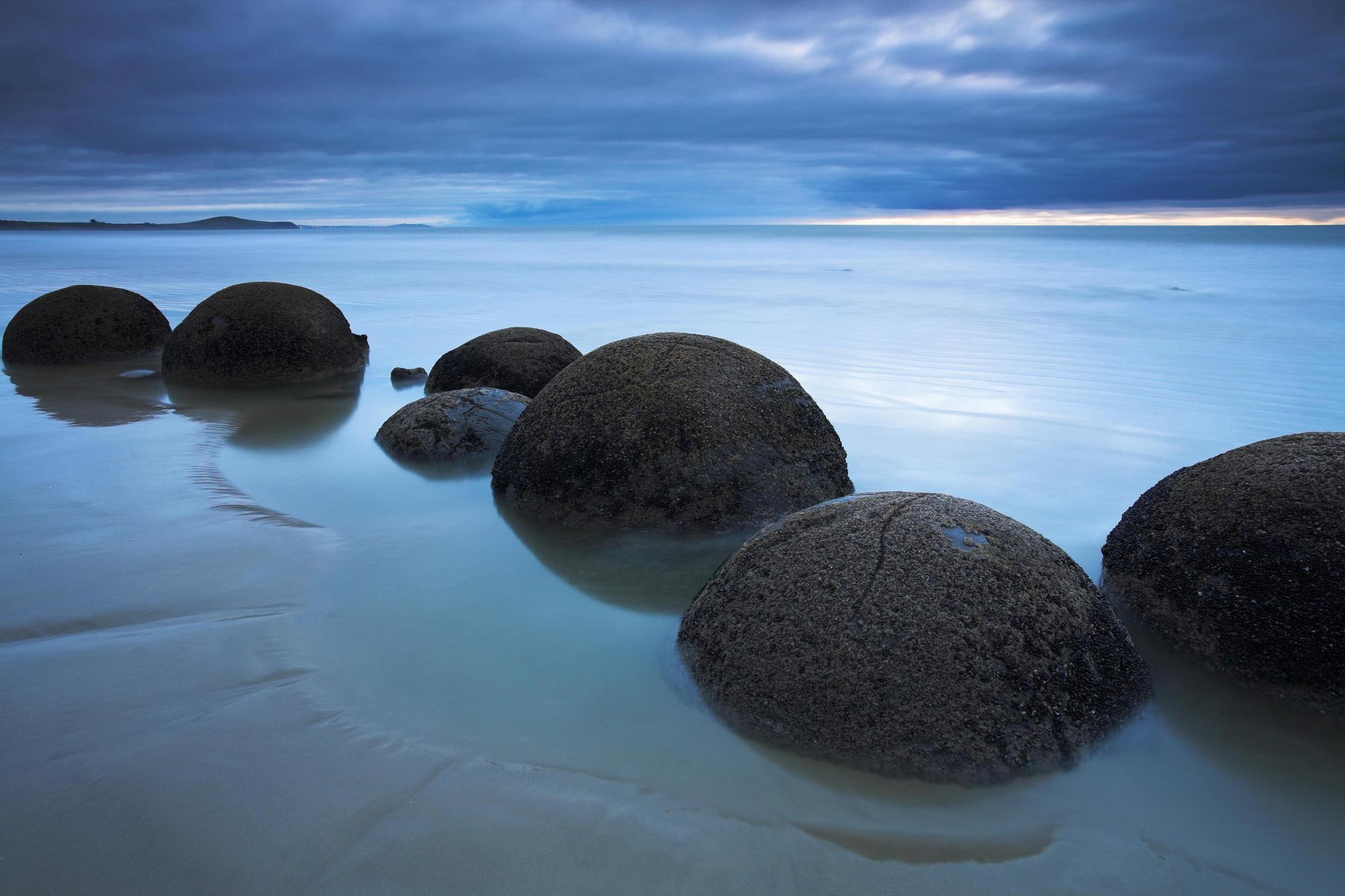 water, calm, isl, blue sky, koekohe, zeal, rocks, peaceful, bolders, moeraki, south, beach, 1080P, stones, sunset, new, moeraki south island, HD Wallpaper