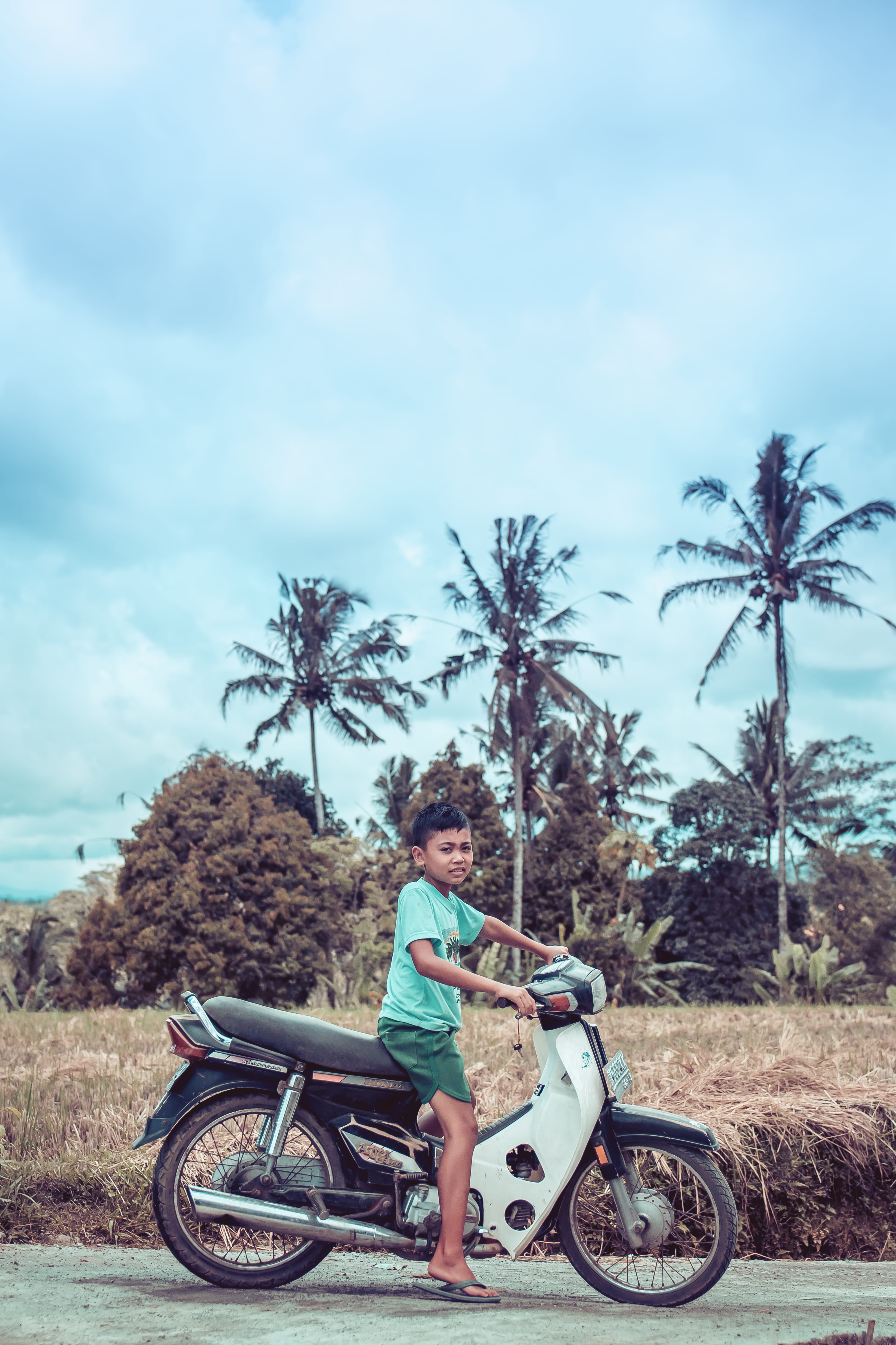 cycle, man, Asian, urban, 5K, females, grass, kid, dangerous, culture, underbone, scooter, seated, biker, boy, cloud - sky, real people, motorbike, ride, Phone HD Wallpaper