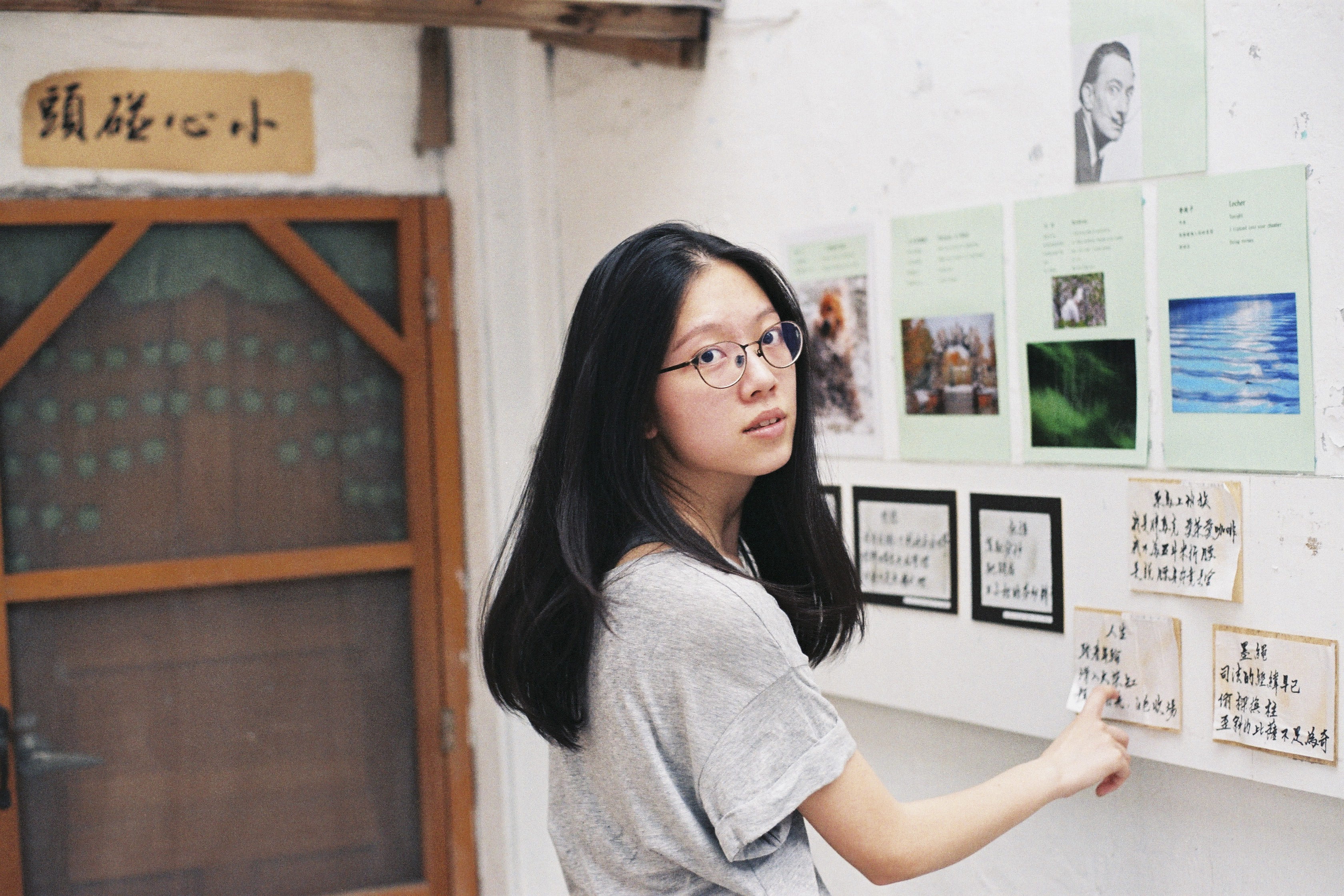 student, text, pointing, long hair, eyecontact, front, adult, bulletin, women, black hair, real people, glasses, standing, contemplation, hairstyle, woman, HD Wallpaper