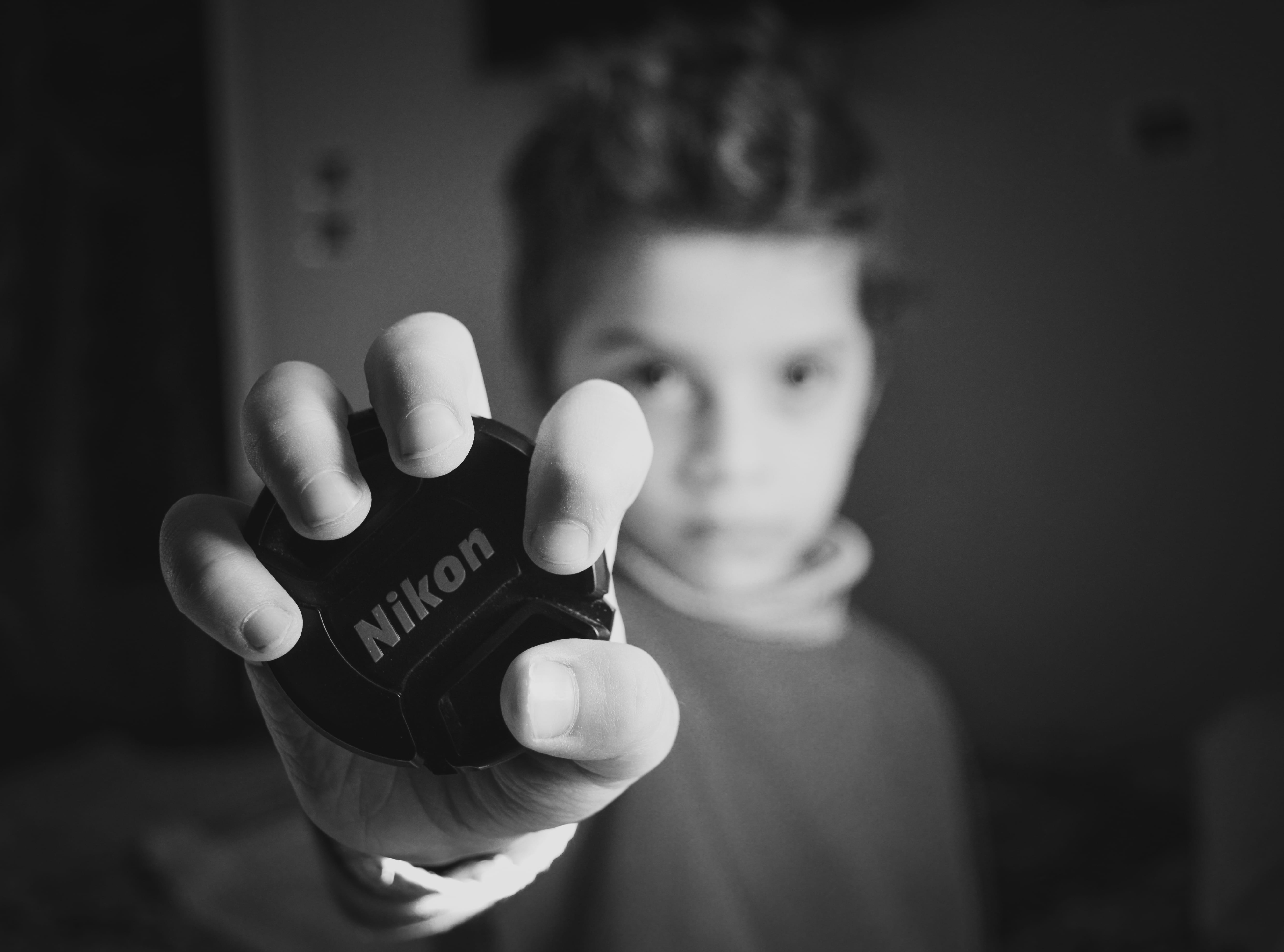 real people, focus, one person, photography, front view, monochrome, portrait, finger, indoors, males, music, conceptual, cute, boys, lens cap, kid, young, HD Wallpaper