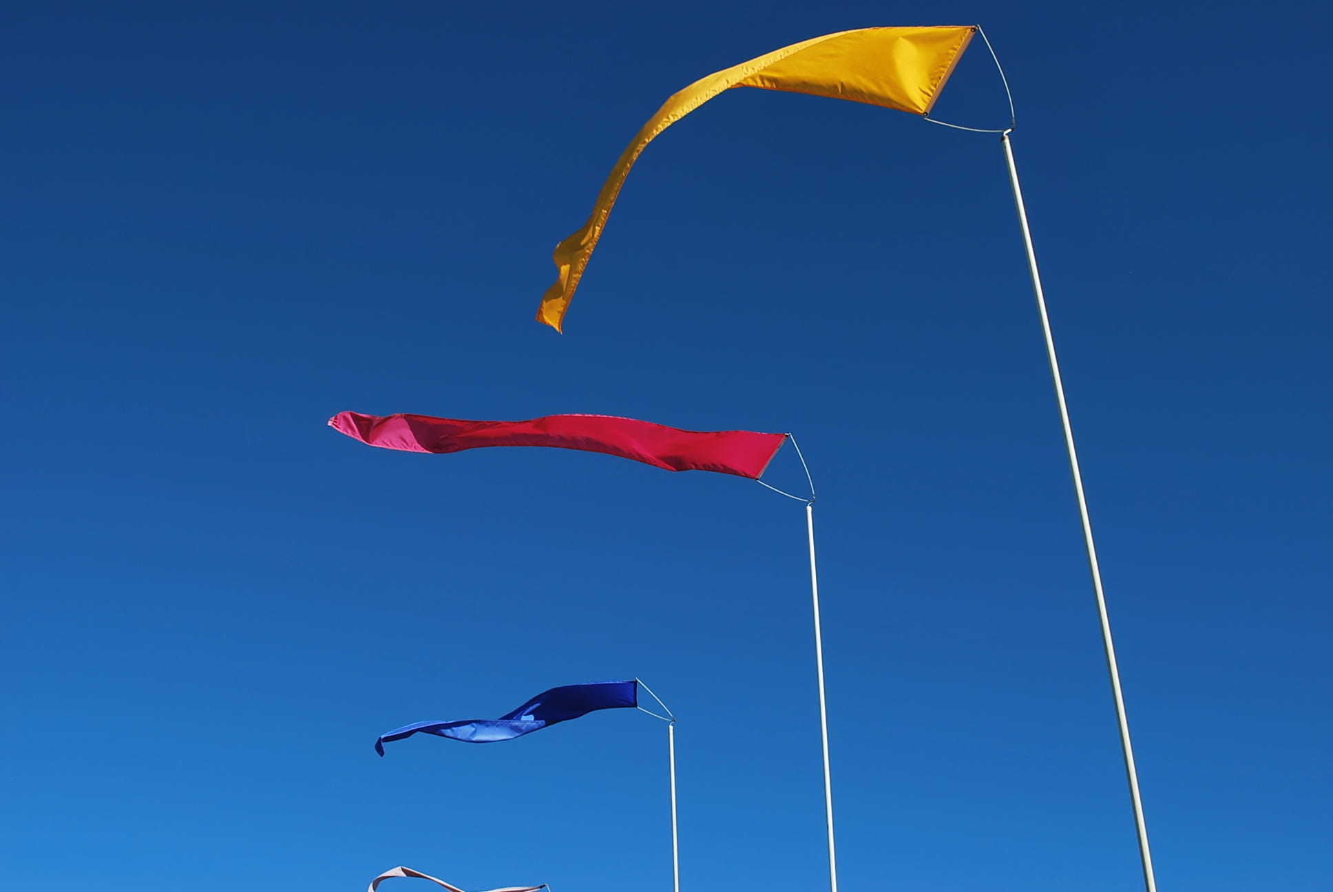 nature, wind, flying, sky, mid-air, clear sky, motion, sunny, flags, day, kite - toy, waving, primary colors, outdoors, no people, flag, freedom, multi colored, HD Wallpaper