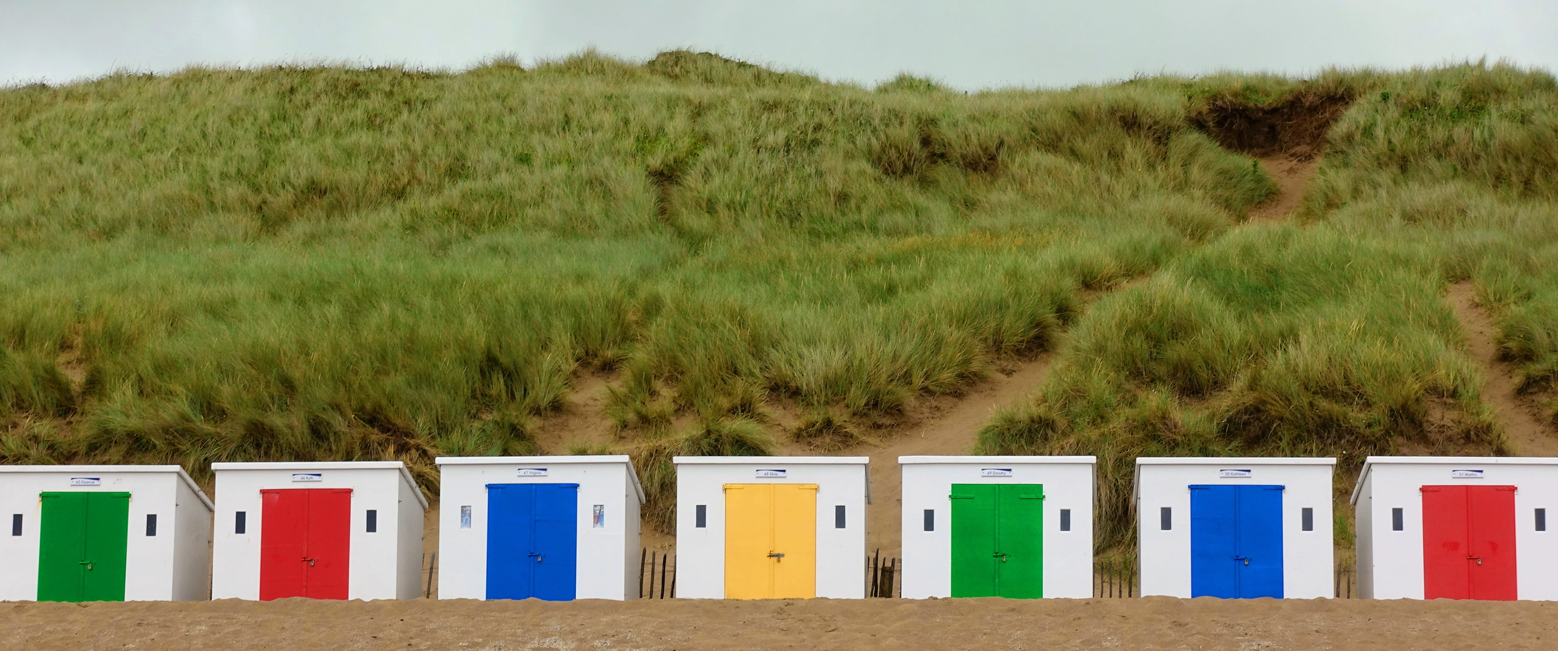 colorful, Hut, water, green color, brown, Cabin, beach, devon, Box, spectrum, bathing, sand, Beach, in a row, primary, blue, land, row, day, yellow, no People, HD Wallpaper