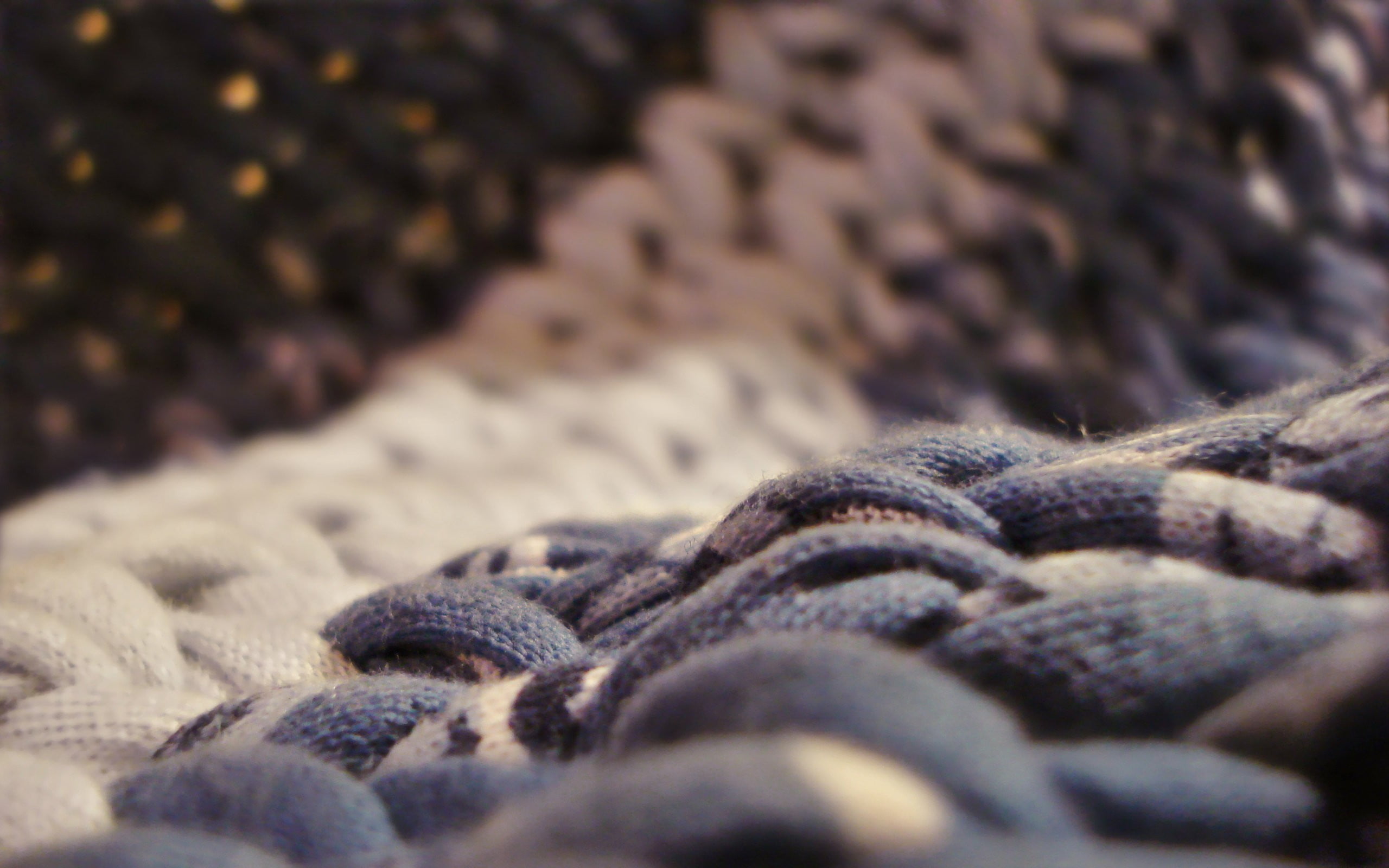 hairstyle, still life, no people, brown, indoors, 2K, warm clothing, pattern, woven, black color, fabric, full frame, close-up, backgrounds, selective focus, HD Wallpaper