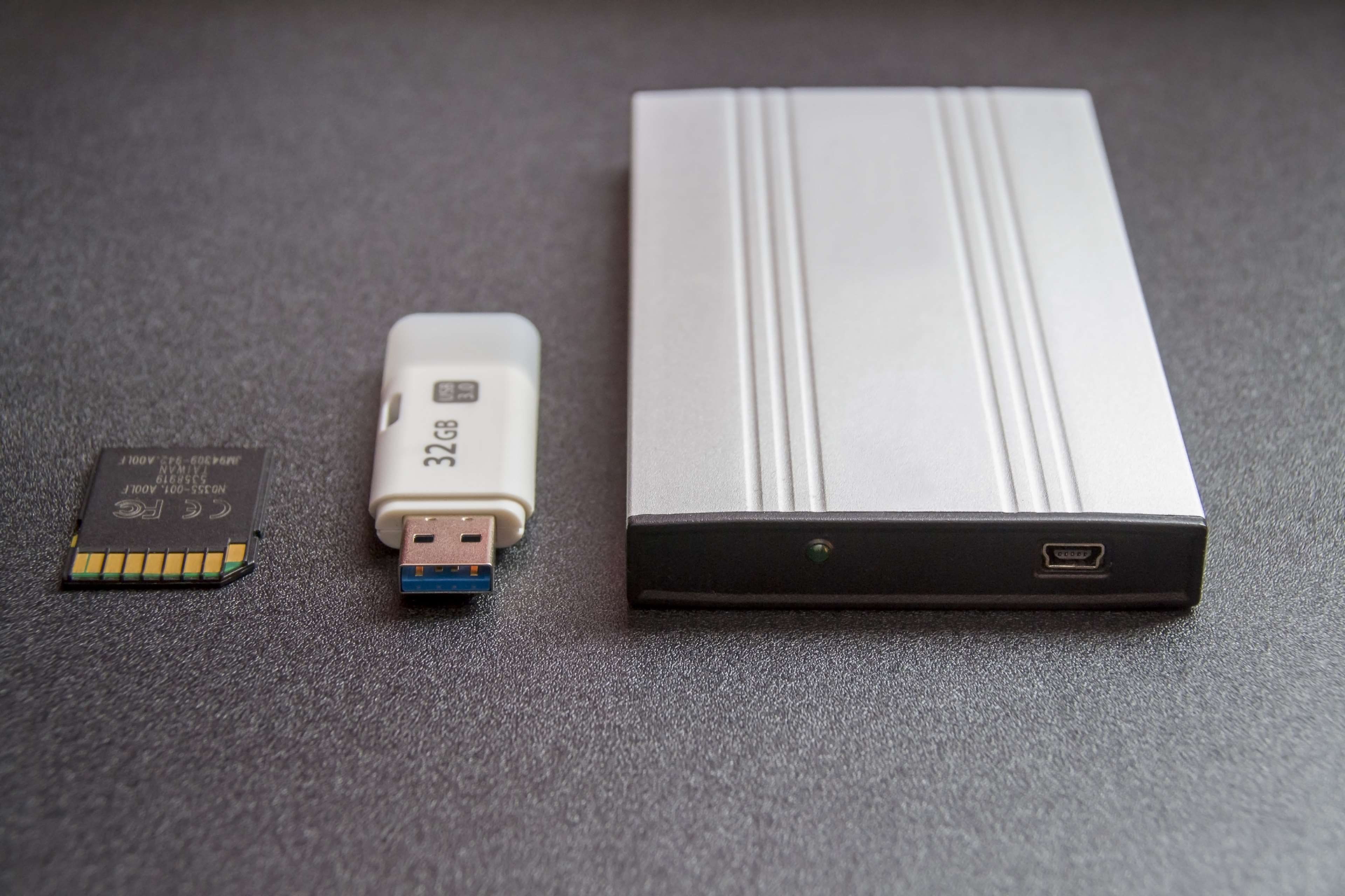 memory stick, technology, data archiving, high technology, mobile hard drive, no people, table, remote control, contemporary media, computer accessories, HD Wallpaper