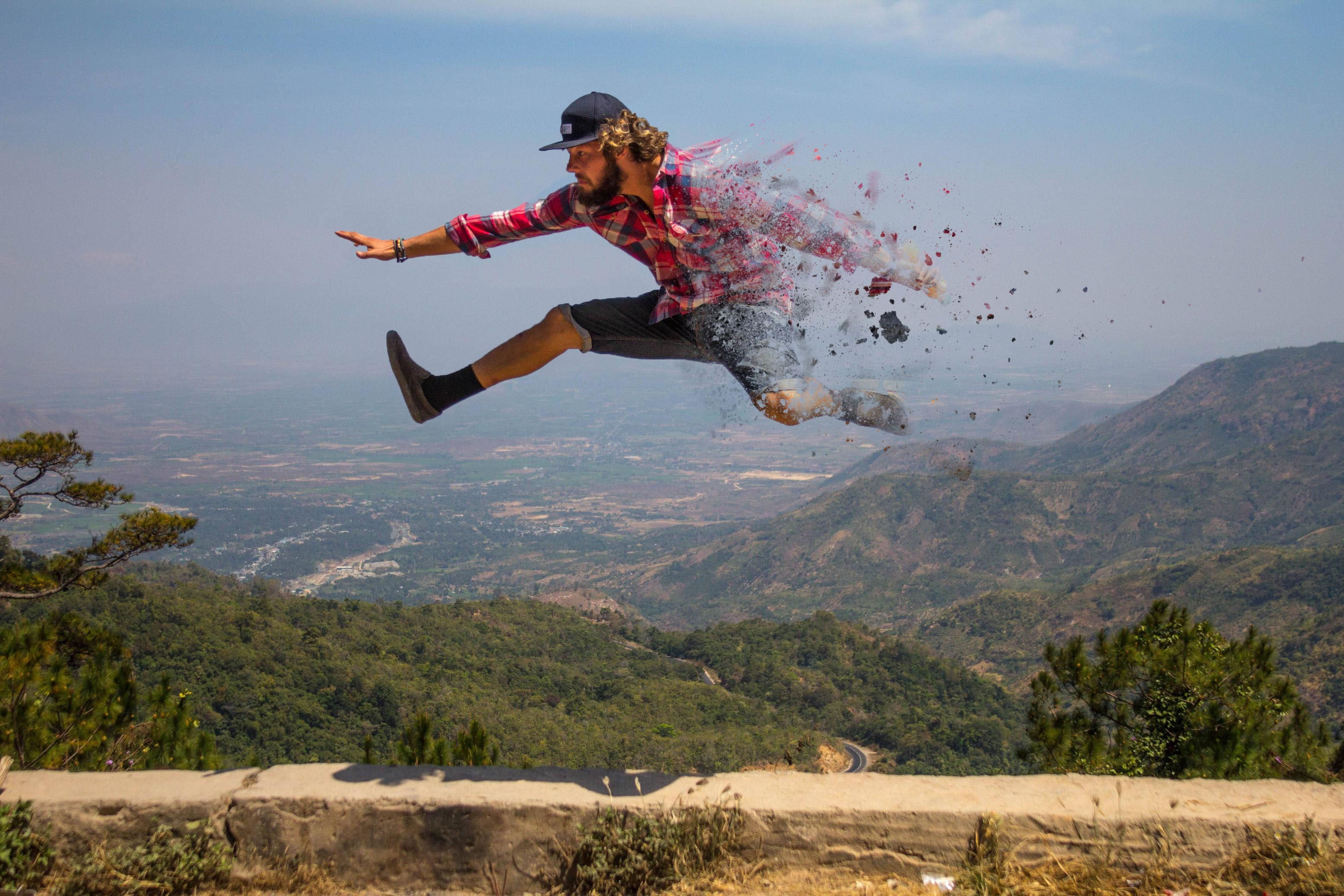 human arm, one person, full length, mid-air, beauty in nature, man, carefree, jumping, freedom, 2K, casual clothing, sky, Photoshop, mountain range, day, HD Wallpaper