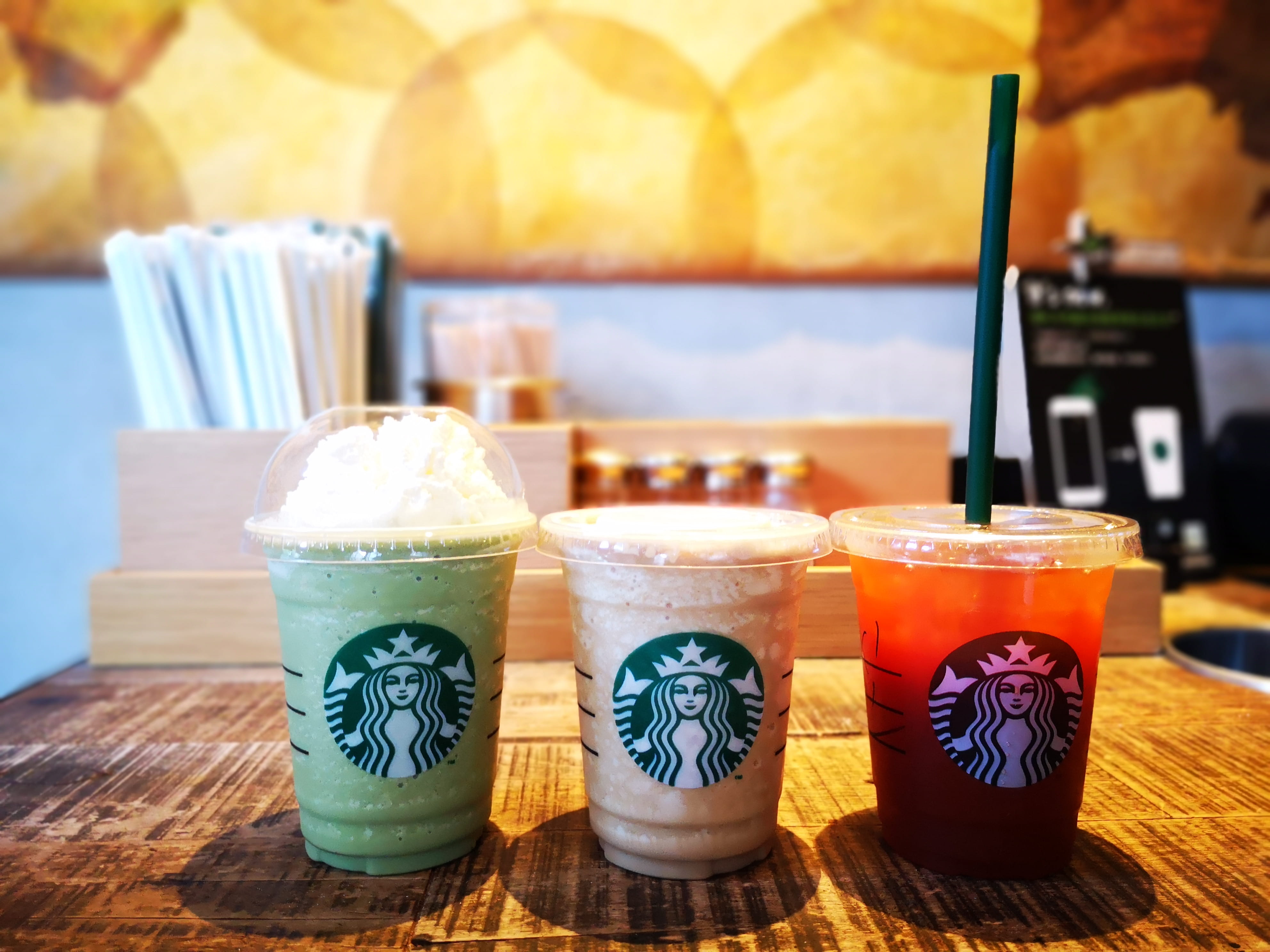 coffee, red, food, nature, close-up, starbucks, sunlight, glass, green, wellbeing, table, focus on foreground, multi colored, store, day, colors, healthy eating, HD Wallpaper